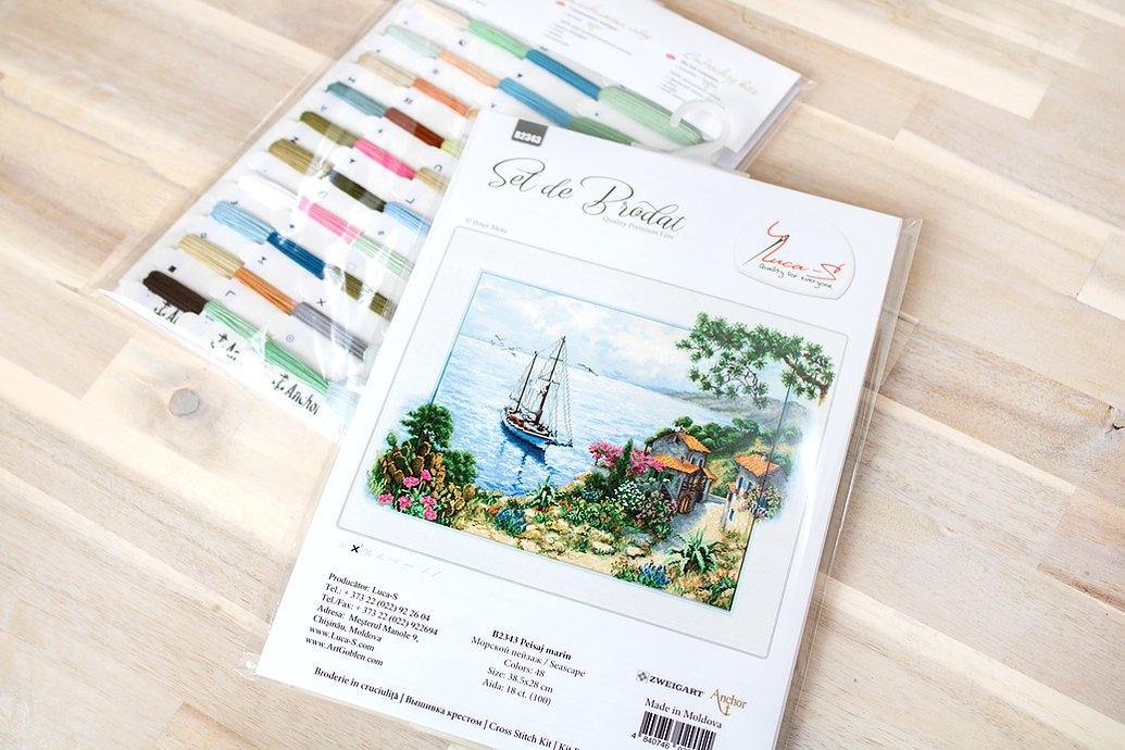 Seascape B2343L Counted Cross-Stitch Kit featuring Aida canvas, colorful threads, and needle for crafting.