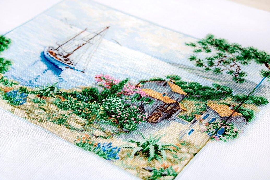 Seascape B2343L Counted Cross-Stitch Kit featuring Aida canvas, colorful threads, and needle for crafting.