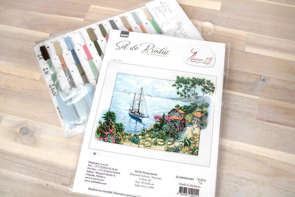 Seascape B2343L Counted Cross-Stitch Kit featuring Aida canvas, colorful threads, and needle for crafting.