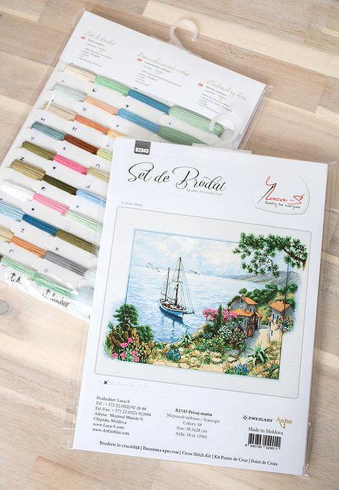 Seascape B2343L Counted Cross-Stitch Kit featuring Aida canvas, colorful threads, and needle for crafting.