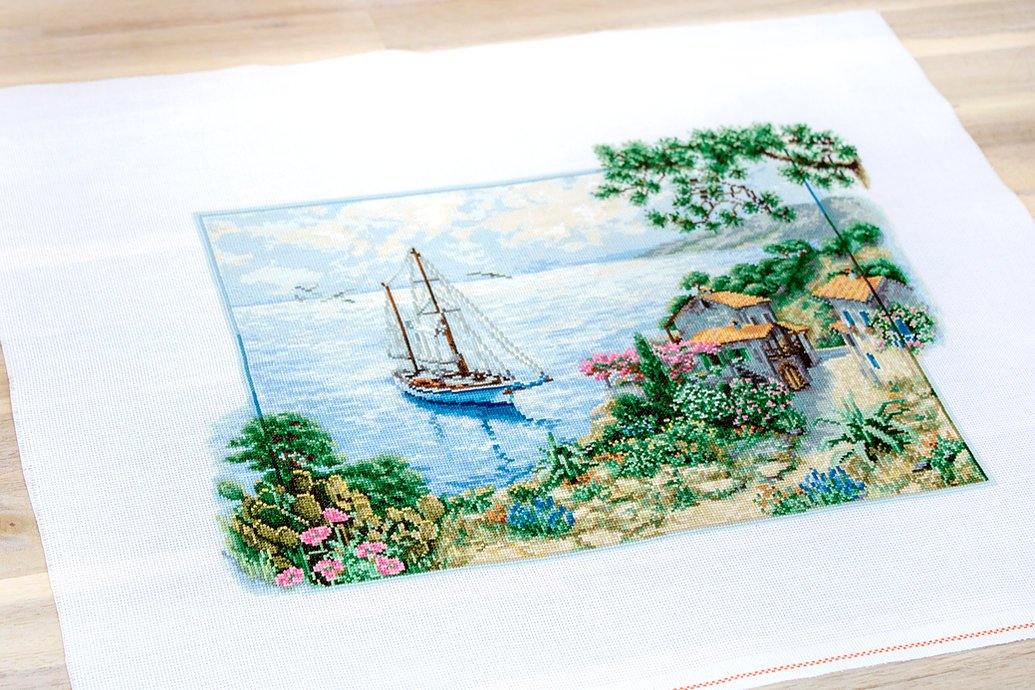 Seascape B2343L Counted Cross-Stitch Kit featuring Aida canvas, colorful threads, and needle for crafting.