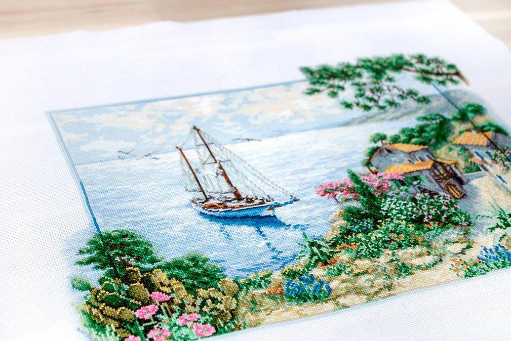 Seascape B2343L Counted Cross-Stitch Kit featuring Aida canvas, colorful threads, and needle for crafting.