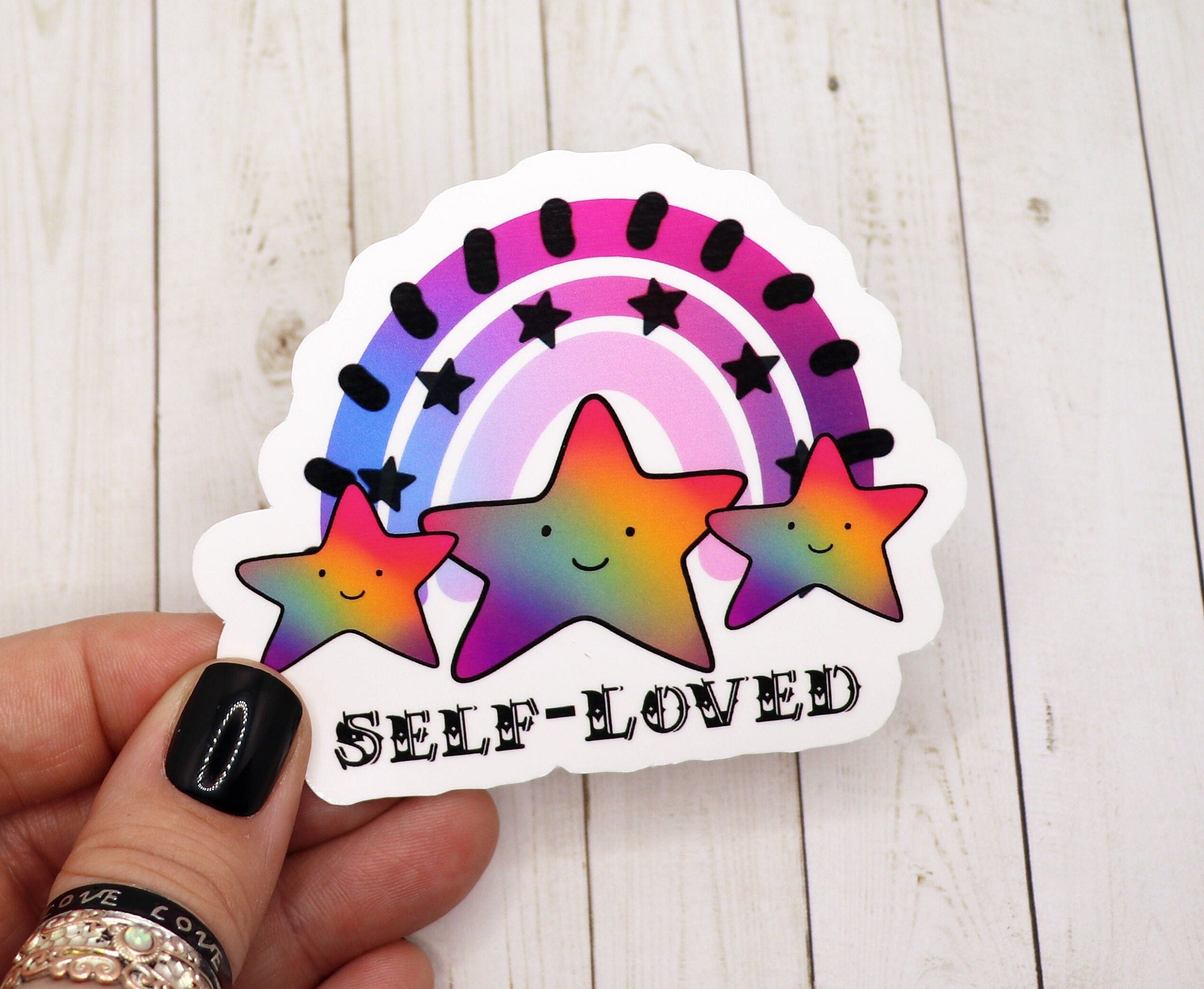 A vibrant Self Love Vinyl Sticker featuring a motivational design, perfect for personalizing various items.