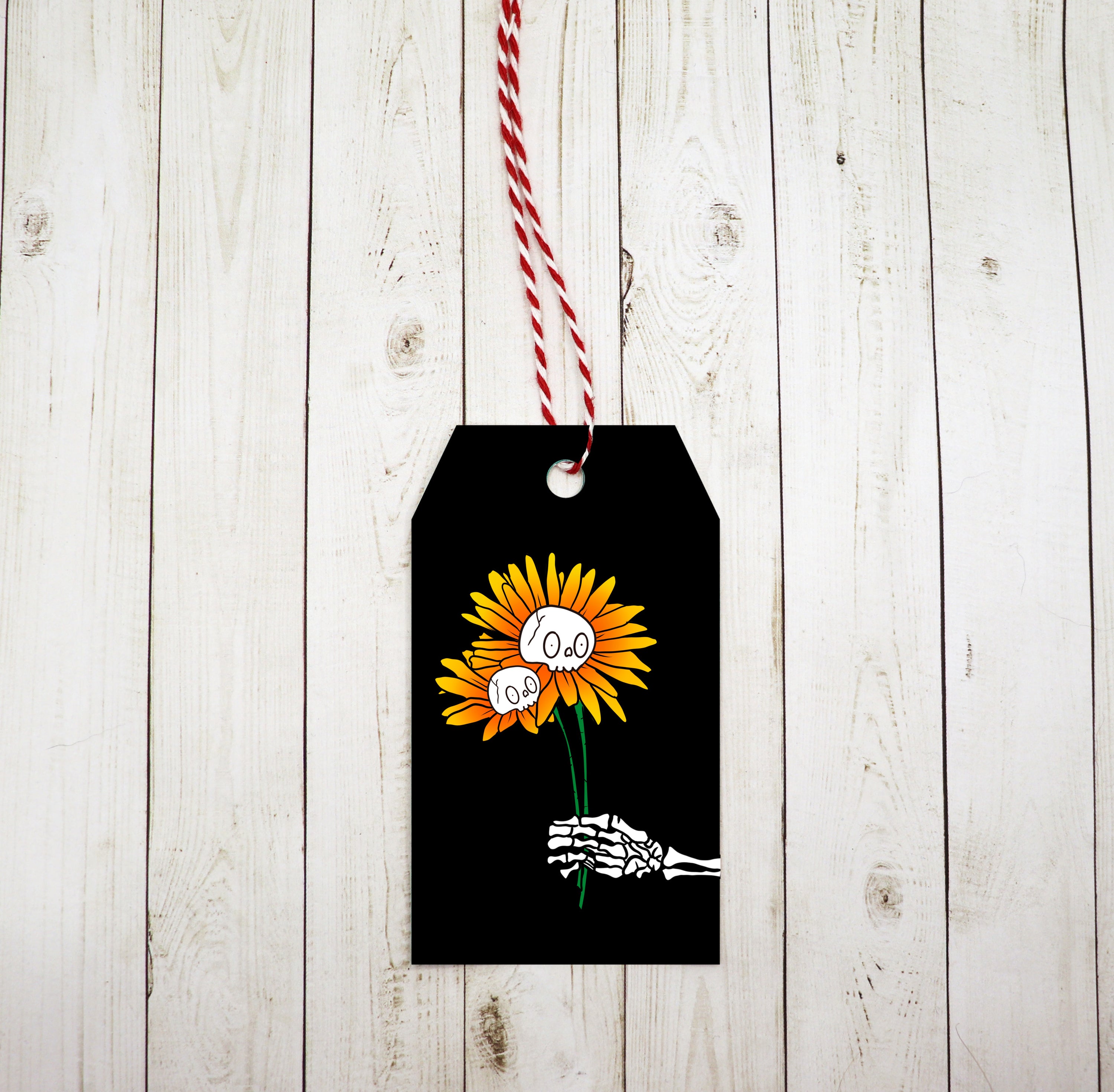 A set of Skeleton Sunflower Gift Tags featuring a whimsical design, red and white twine, printed on heavy white cardstock.