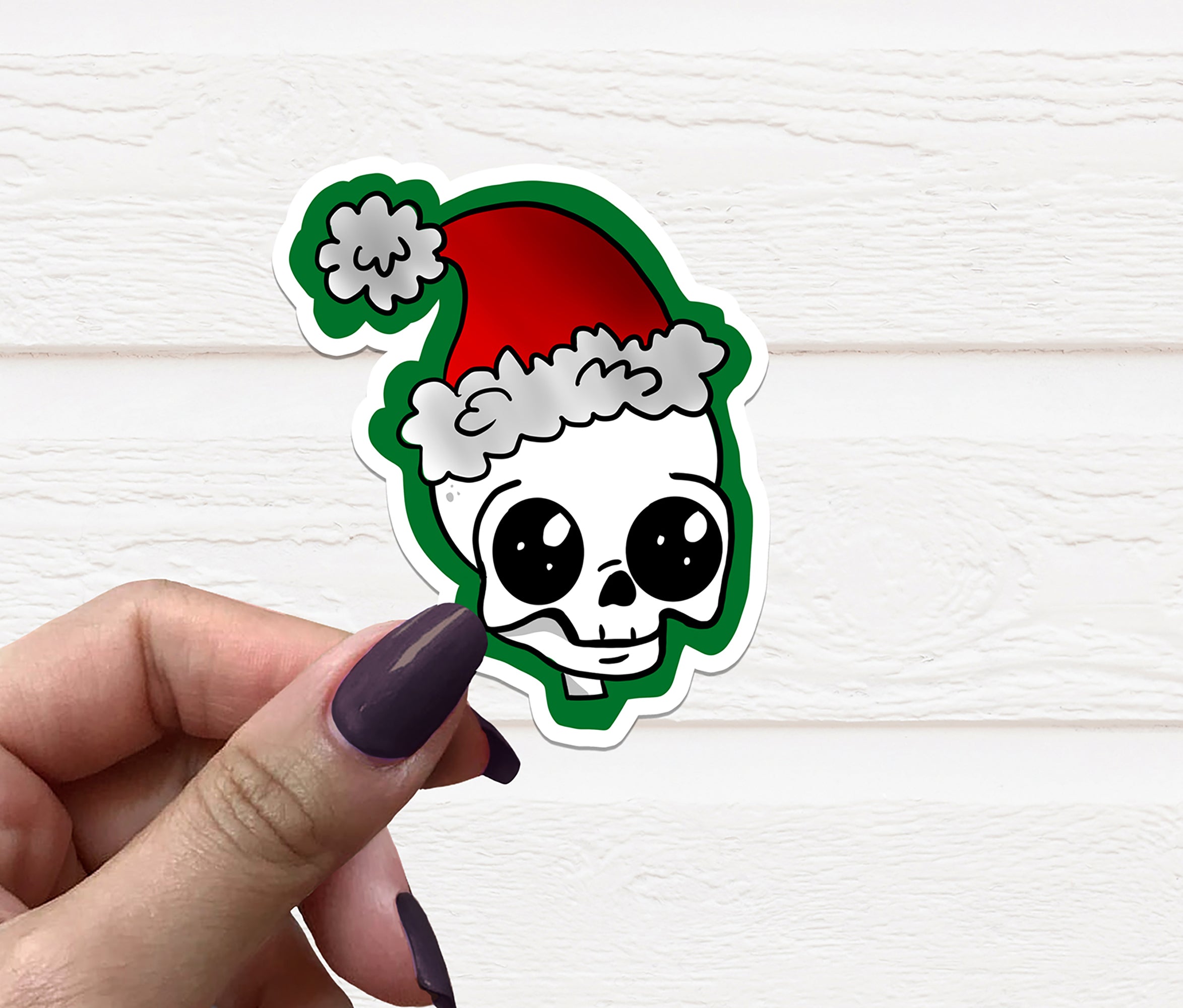 A vibrant Skull Santa Vinyl Sticker featuring a playful skull wearing a Santa hat, perfect for holiday decorations.