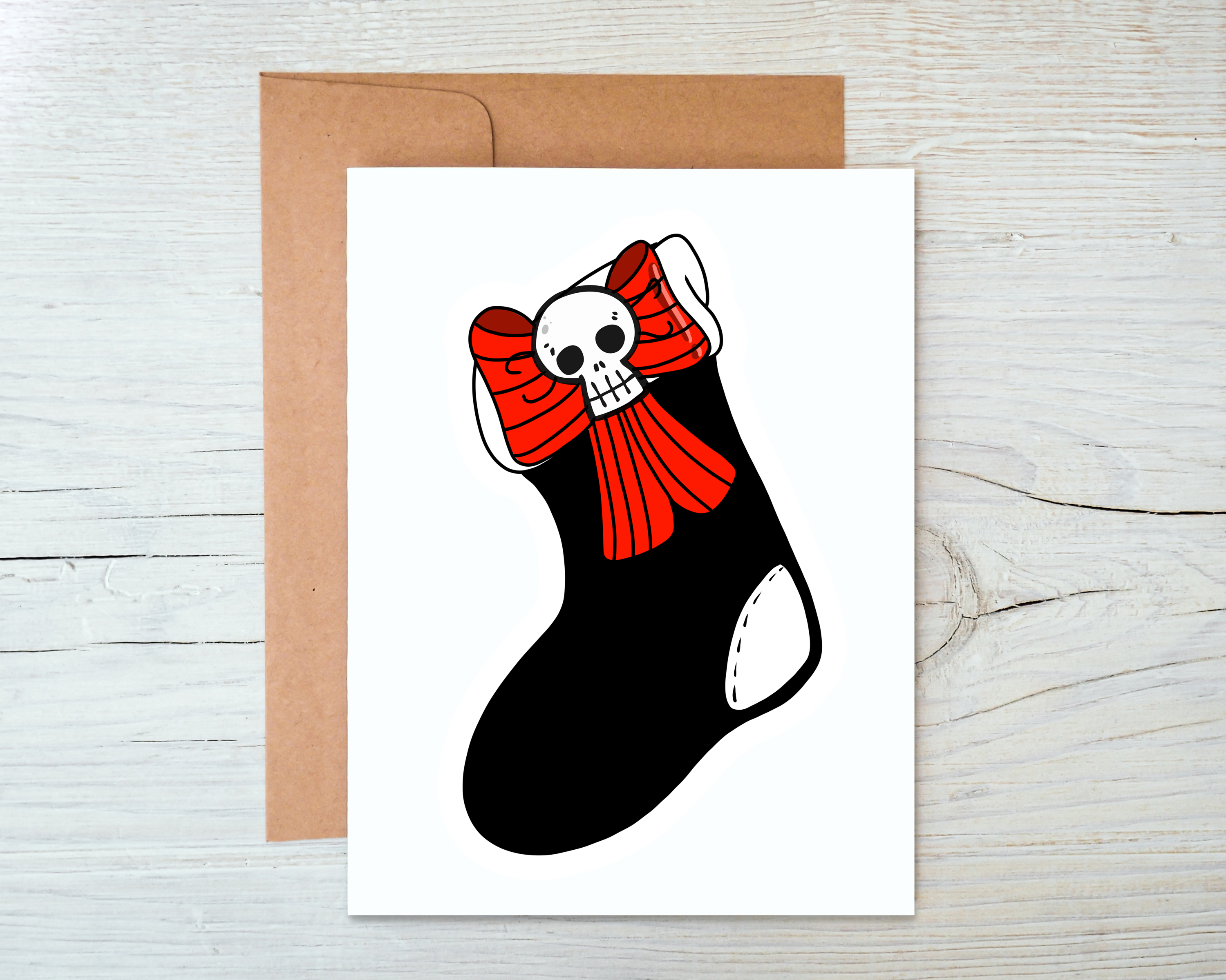 Skull Stocking Card with blank interior and kraft envelope, featuring a spooky skull design.