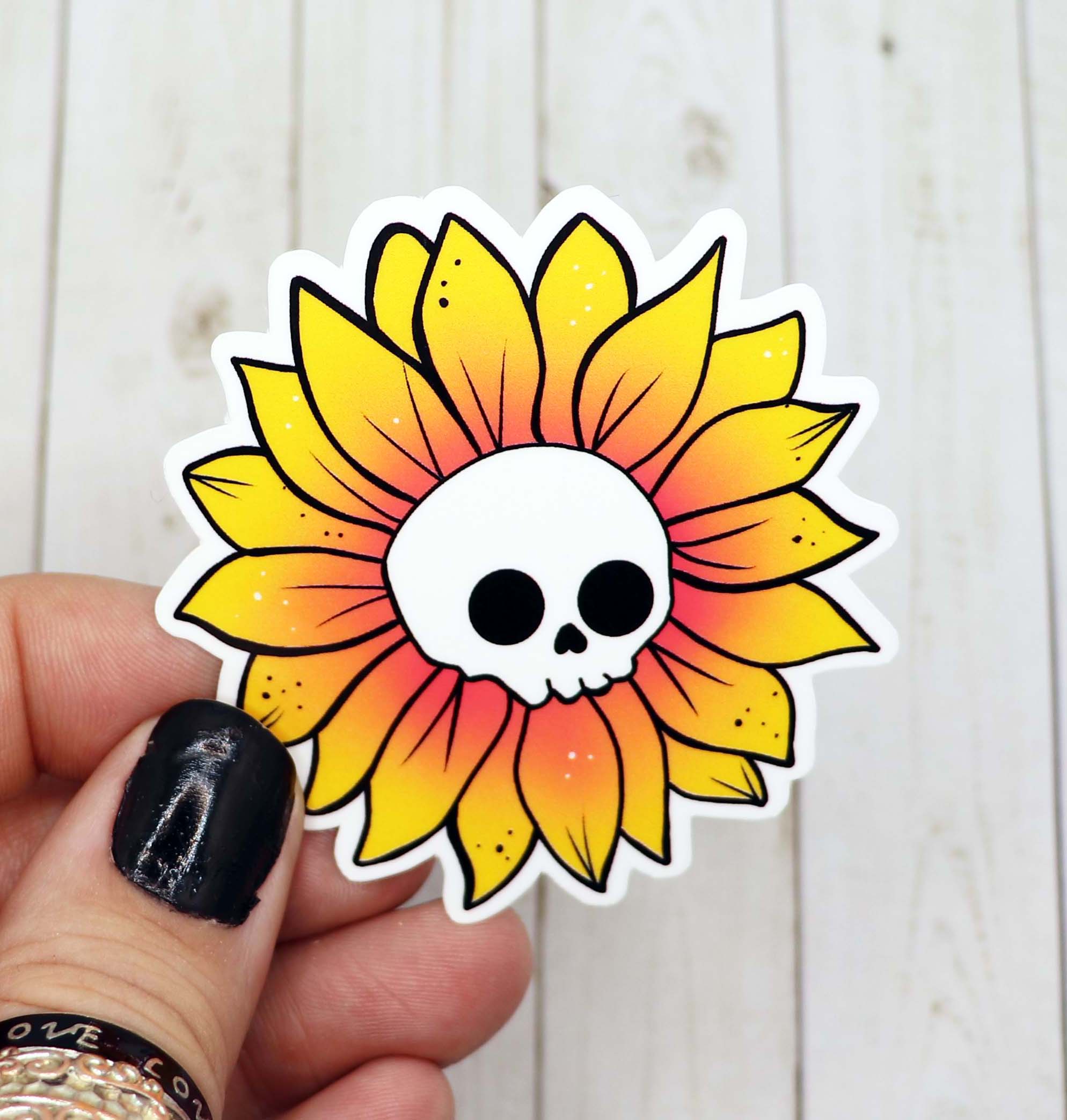 A vibrant Skull Sunflower Sticker featuring a skull surrounded by colorful sunflowers, printed on matte vinyl.