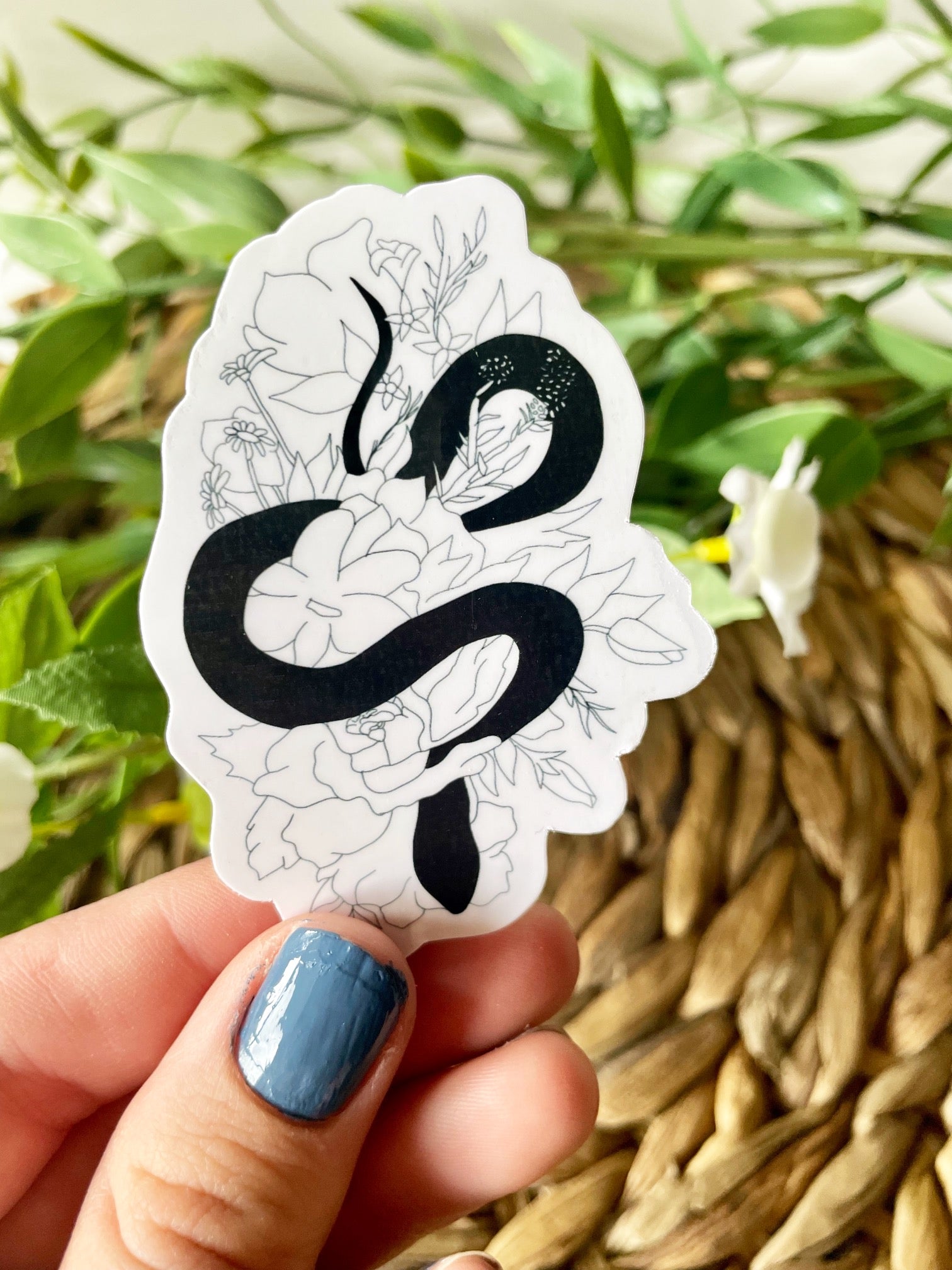 A cute snake floral sticker featuring a snake intertwined with colorful flowers, perfect for personalizing items.