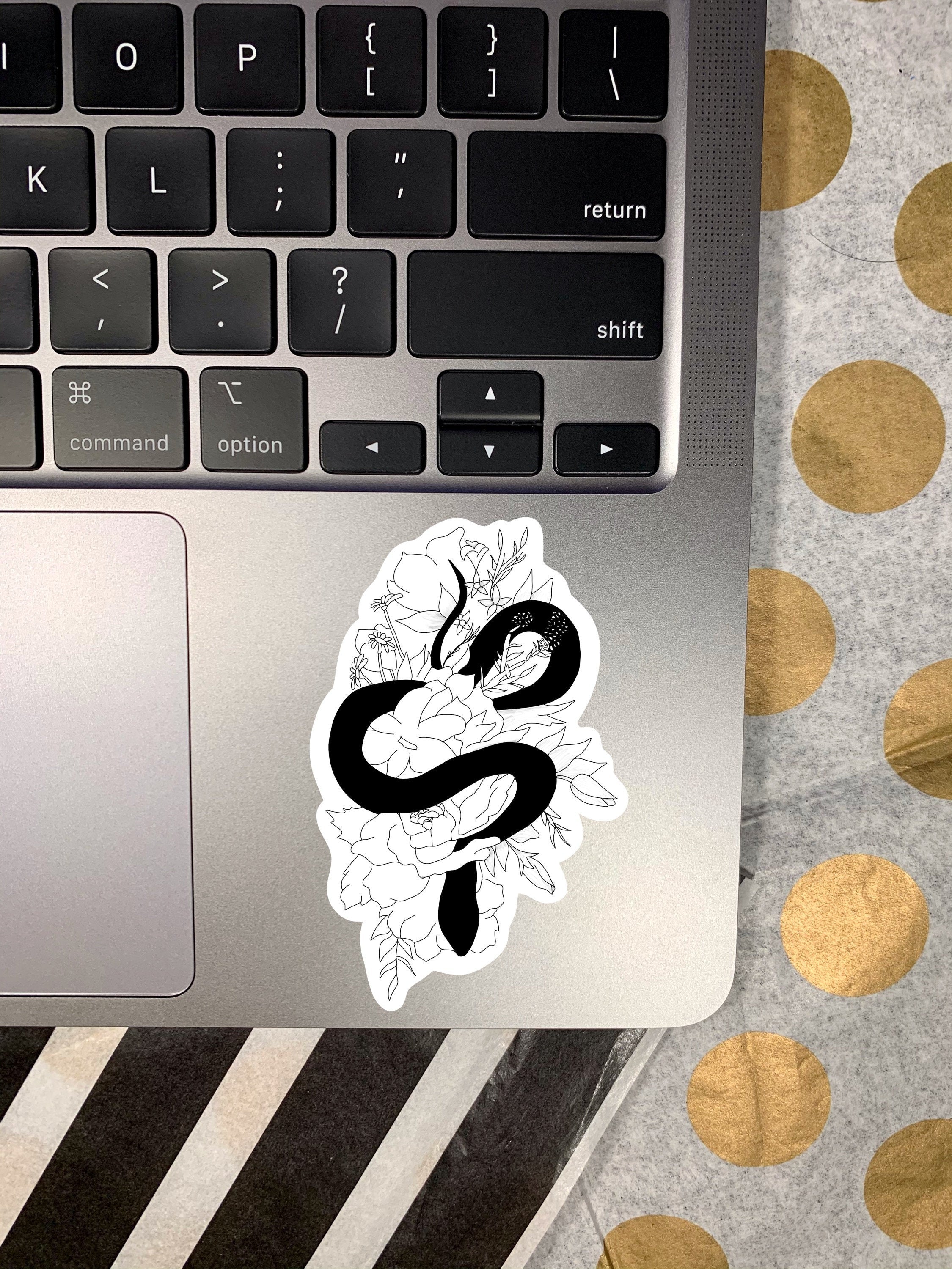 A cute snake floral sticker featuring a snake intertwined with colorful flowers, perfect for personalizing items.