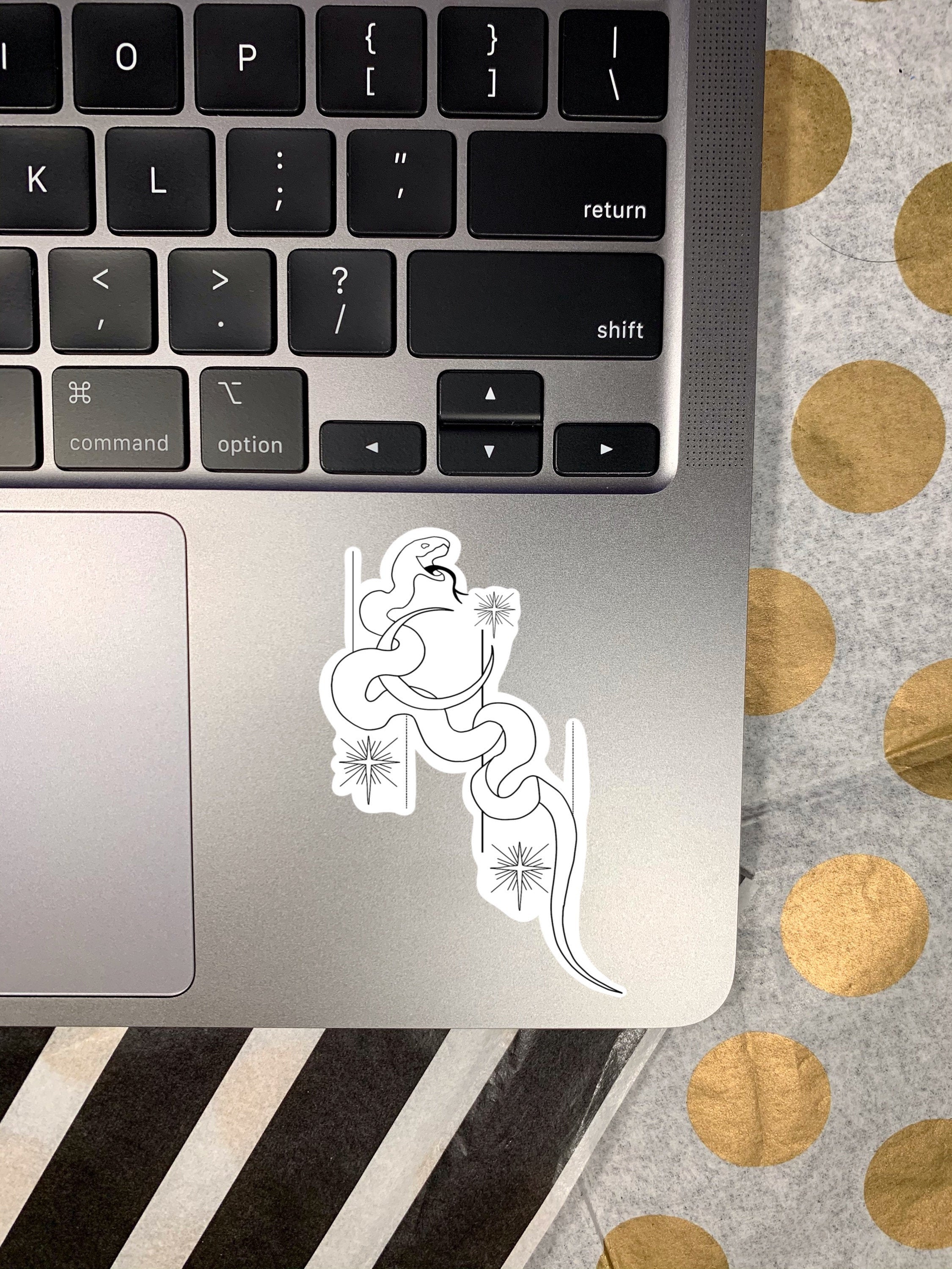 A stylish Snake Moon Sticker featuring a snake intertwined with a moon, perfect for personalizing items.