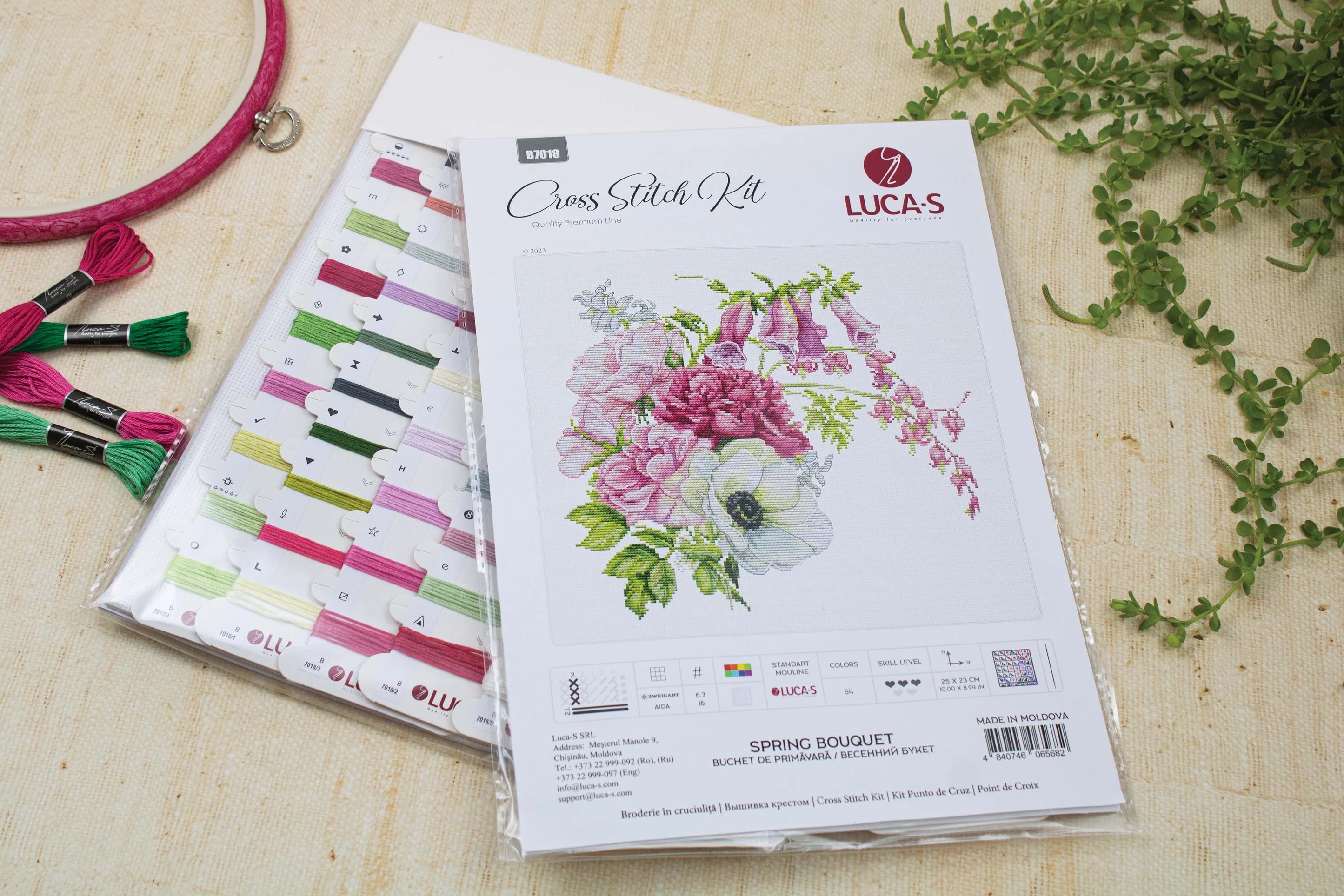 Spring Bouquet B7018L Counted Cross-Stitch Kit featuring colorful threads, canvas, and needle for crafting.