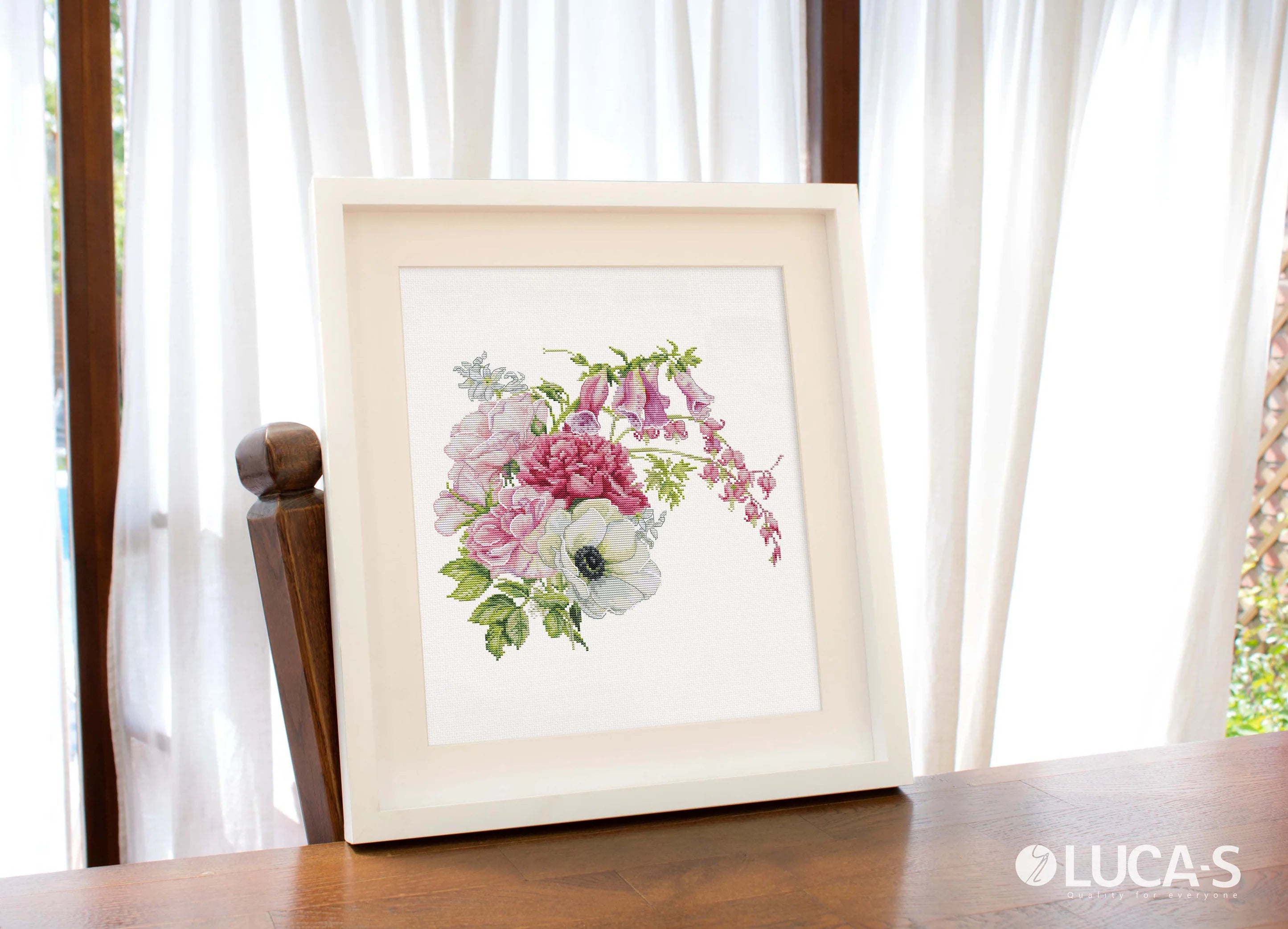 Spring Bouquet B7018L Counted Cross-Stitch Kit featuring colorful threads, canvas, and needle for crafting.