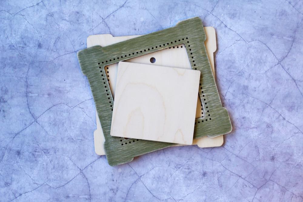 Square Frame Green OP-265 made of plywood, ideal for cross stitch projects, featuring special holes for easy fabric stretching.