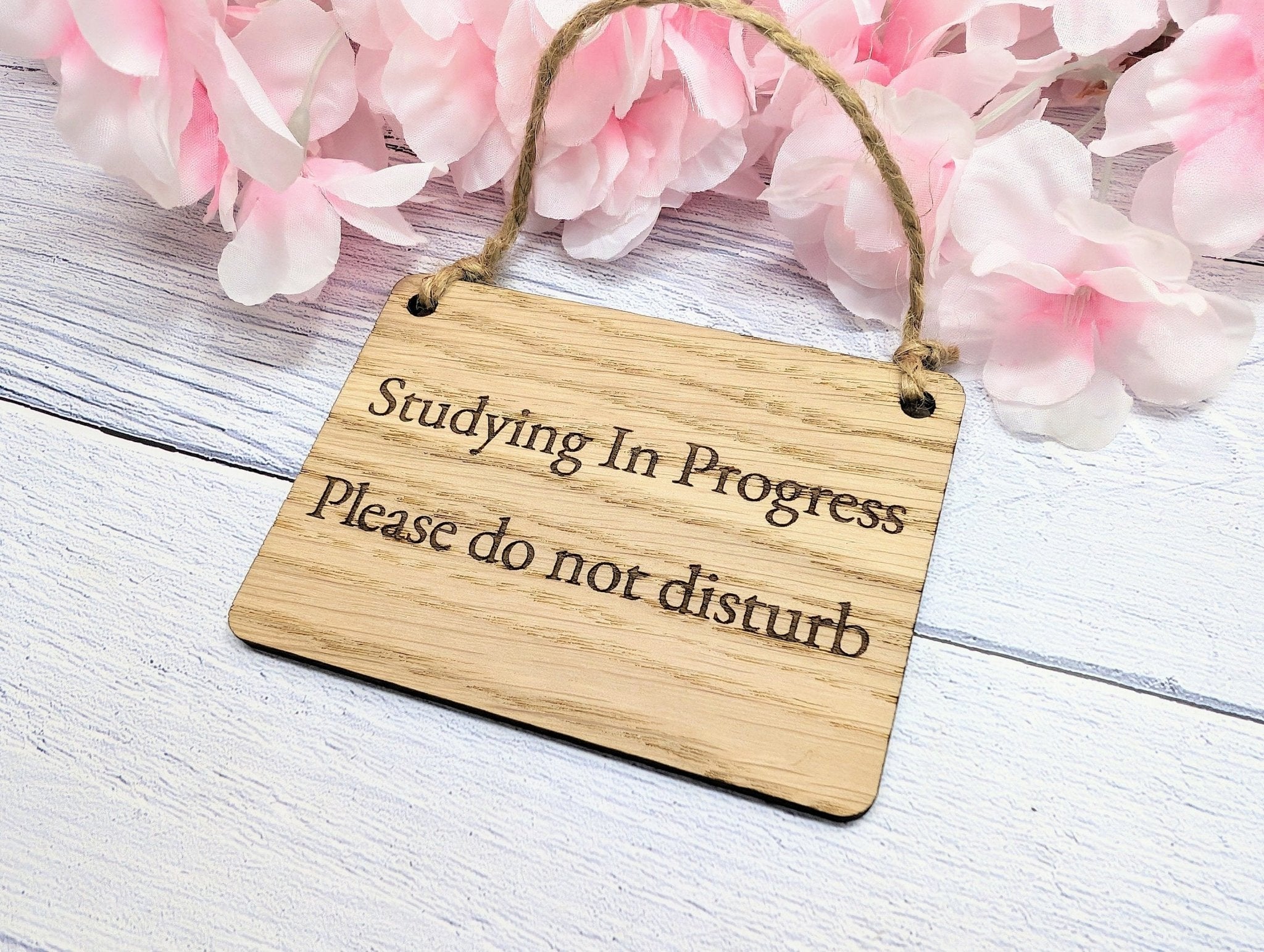 Handcrafted oak door sign reading 'Studying in Progress' with natural wood grain, perfect for maintaining study privacy.