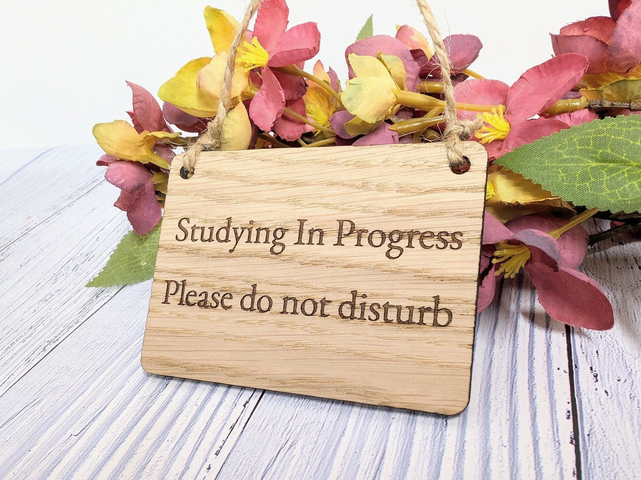 Handcrafted oak door sign reading 'Studying in Progress' with natural wood grain, perfect for maintaining study privacy.