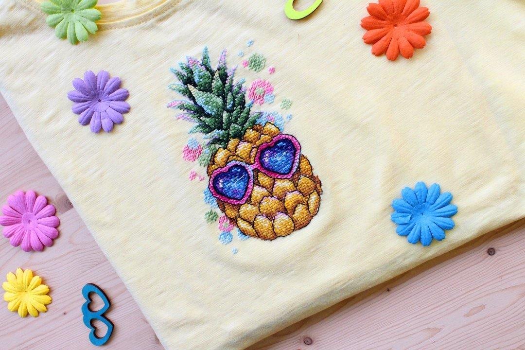 Sunny Pineapple SV-533 Cross-stitch kit featuring vibrant threads, soluble canvas, and a needle for crafting.