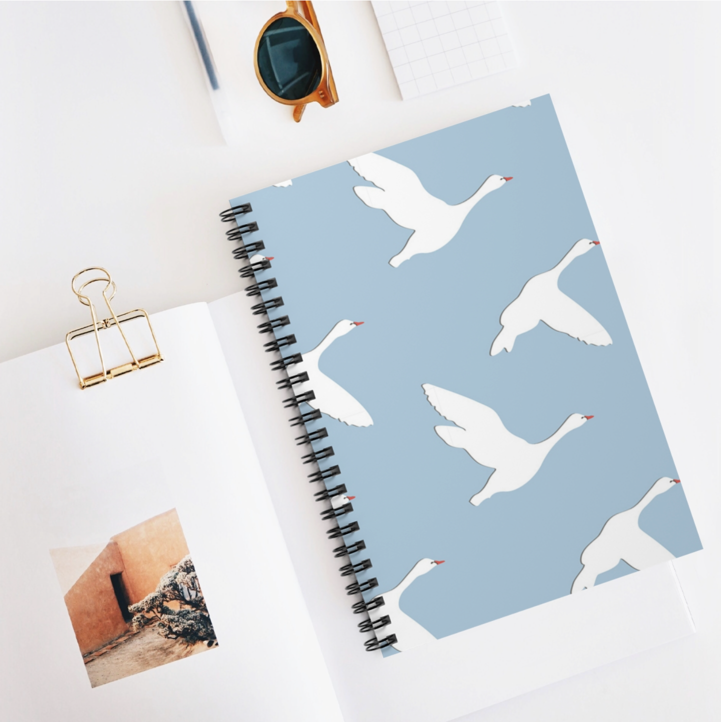 Swans Lined Notebook featuring black spiral binding and A5 size with 100 lined pages.