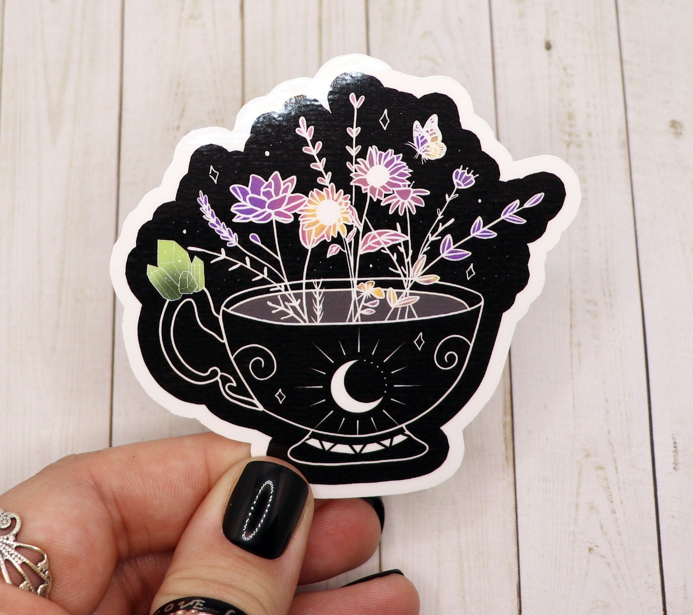 A collection of vibrant tea-themed stickers on a matte vinyl surface, showcasing various tea designs.