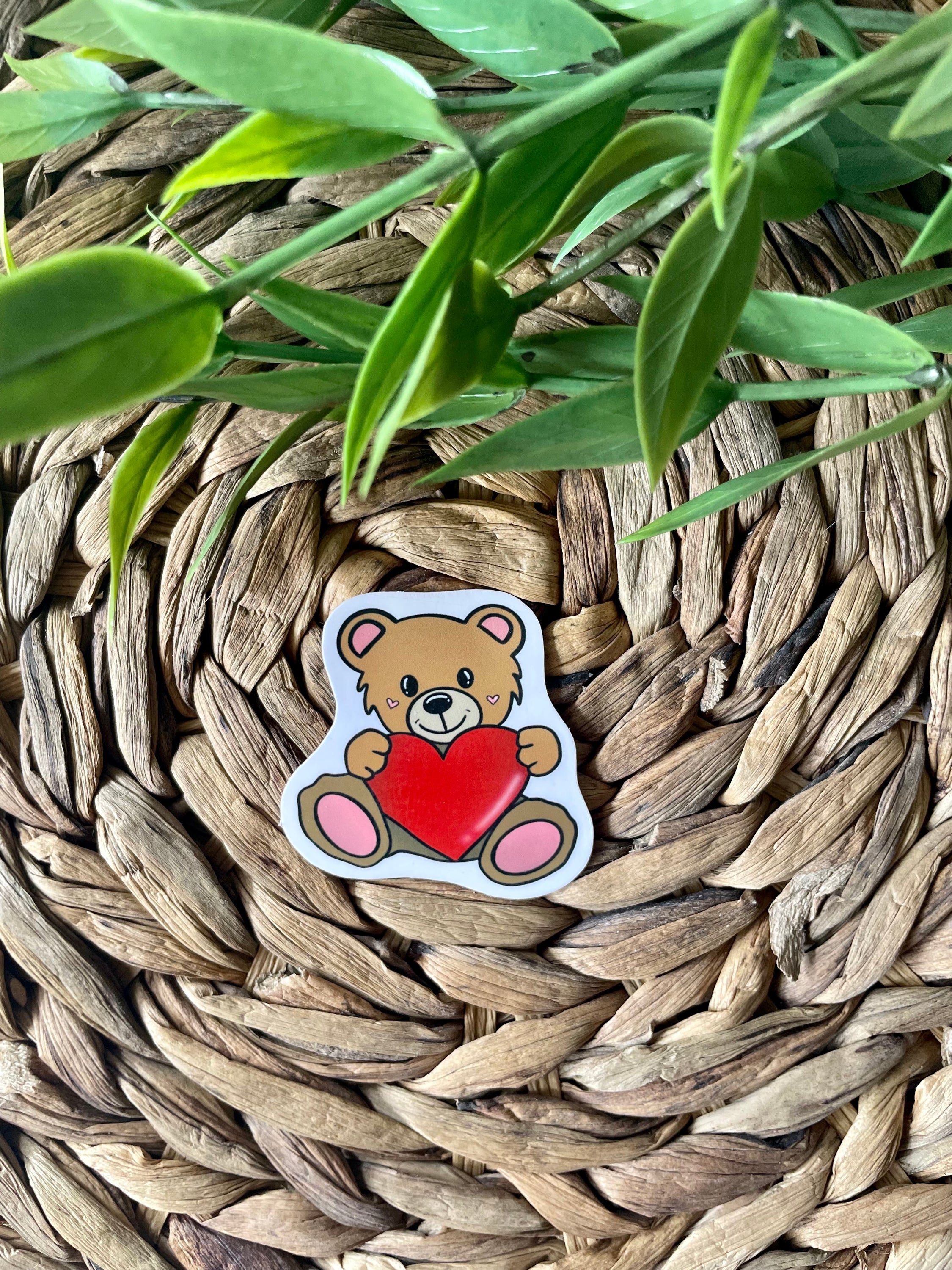 A cute teddy bear sticker designed for personalizing items like hydroflasks and laptops, featuring a charming bear illustration.