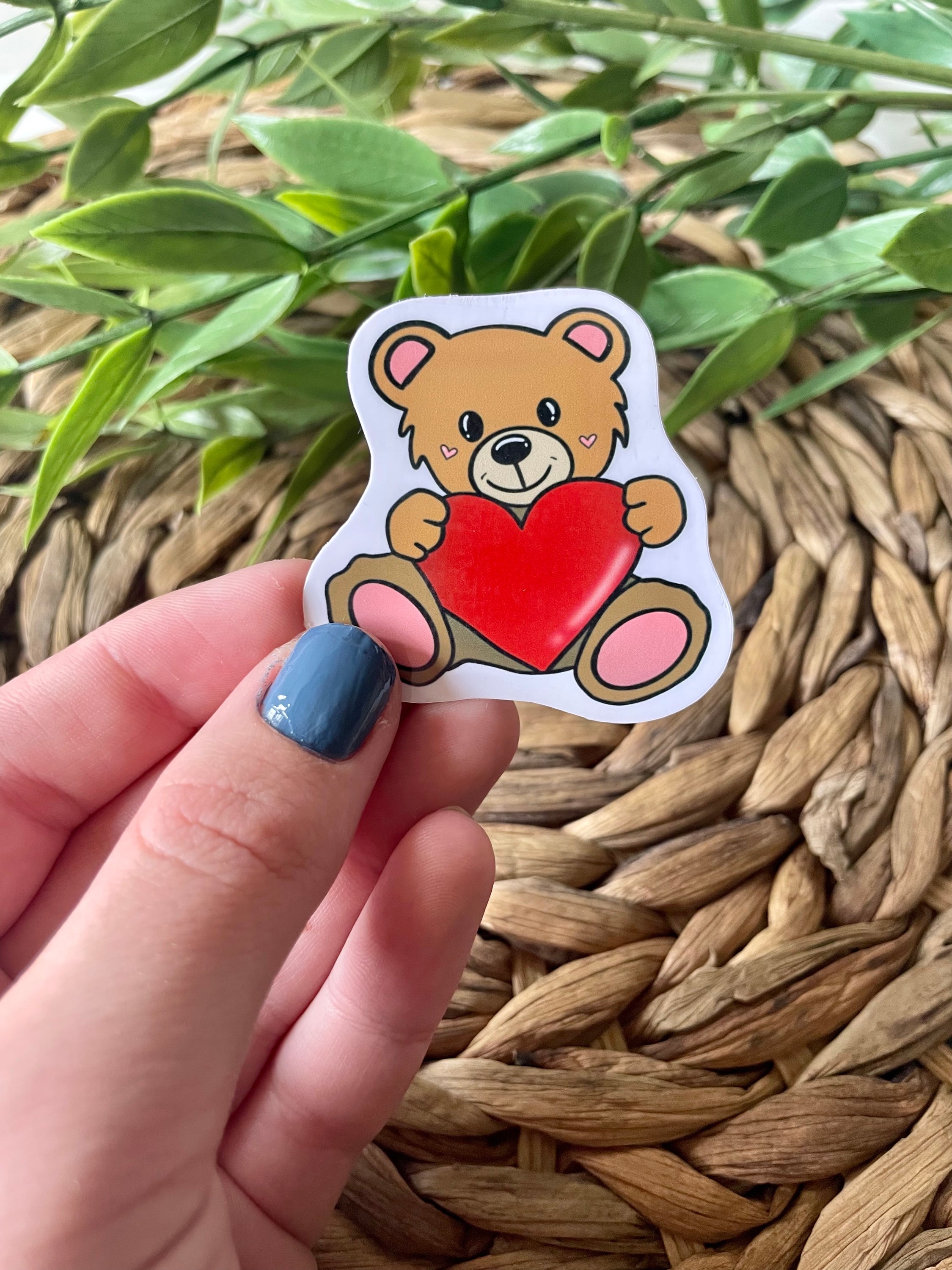 A cute teddy bear sticker designed for personalizing items like hydroflasks and laptops, featuring a charming bear illustration.