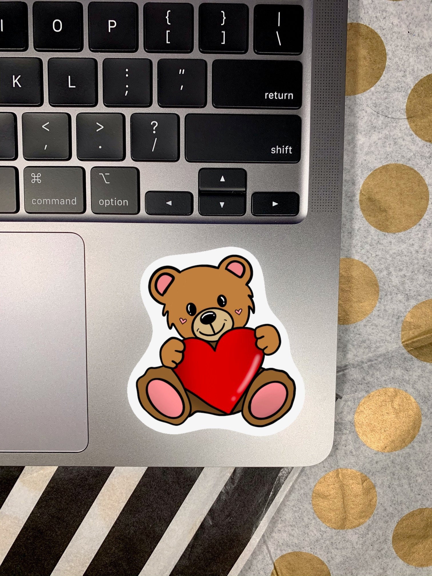 A cute teddy bear sticker designed for personalizing items like hydroflasks and laptops, featuring a charming bear illustration.