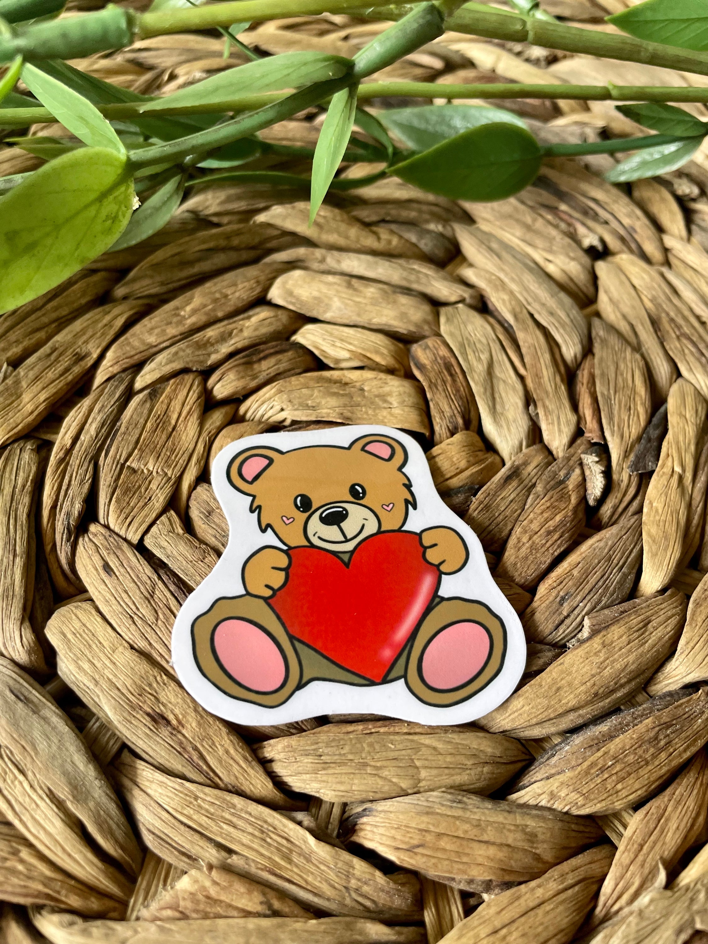 A cute teddy bear sticker designed for personalizing items like hydroflasks and laptops, featuring a charming bear illustration.