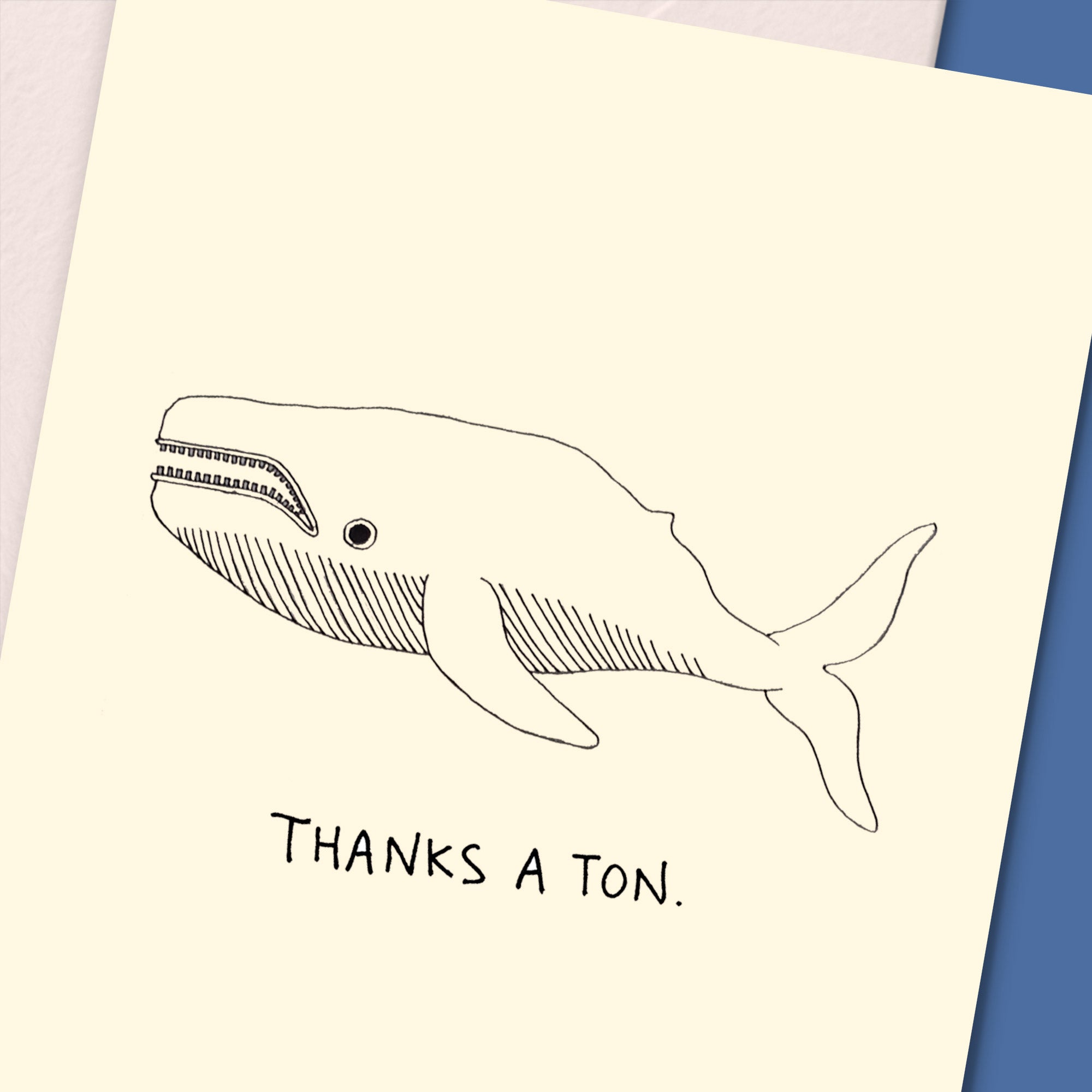 A cute thank you card featuring a whale design, perfect for expressing gratitude, with a recycled envelope.