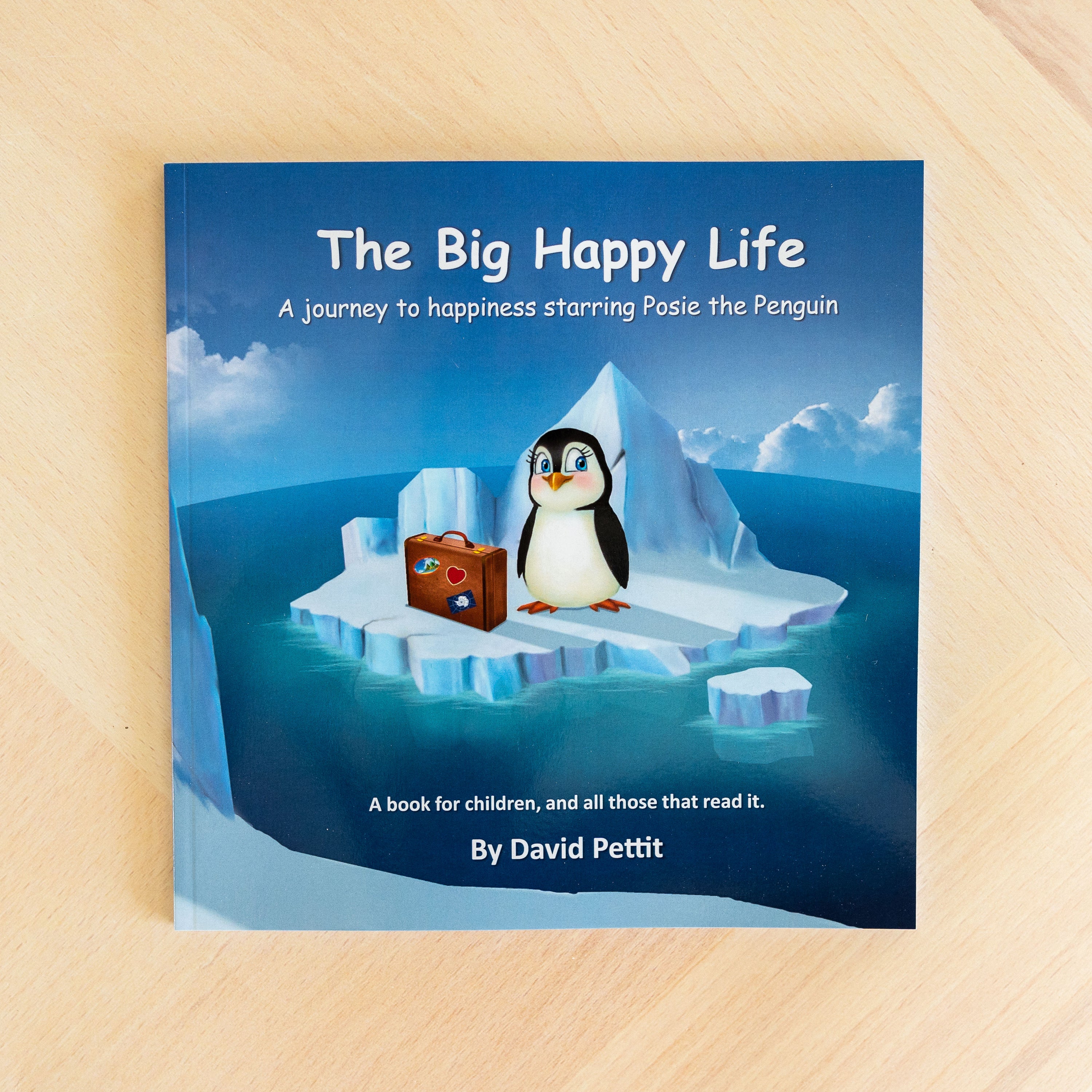 Cover of 'The BIG Happy Life' featuring Posie the Penguin on a colorful adventure, symbolizing self-discovery and happiness.