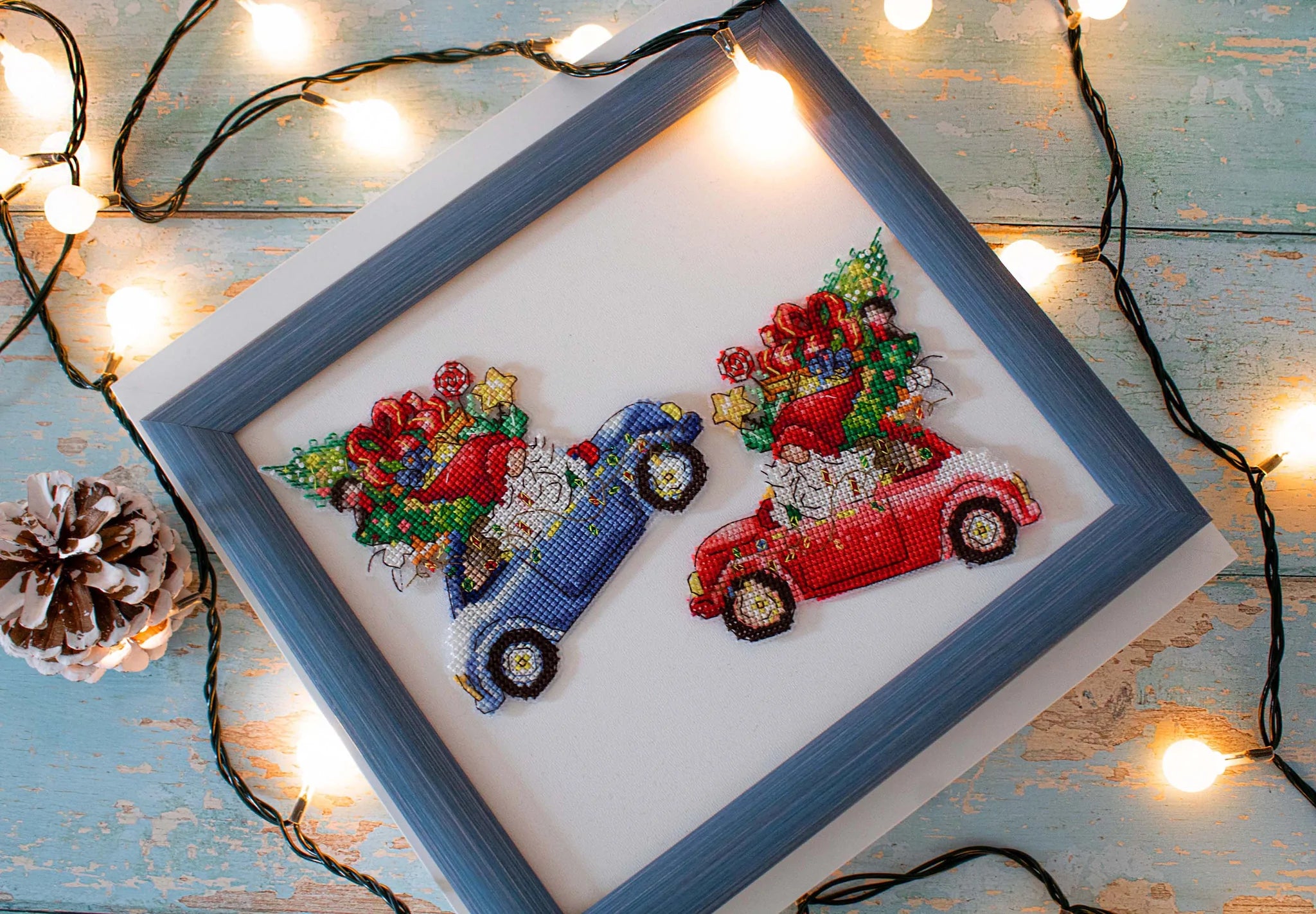 The Gift Car JK035L Counted Cross-Stitch Kit featuring colorful threads, Aida Plastic canvas, and a needle, perfect for crafting.