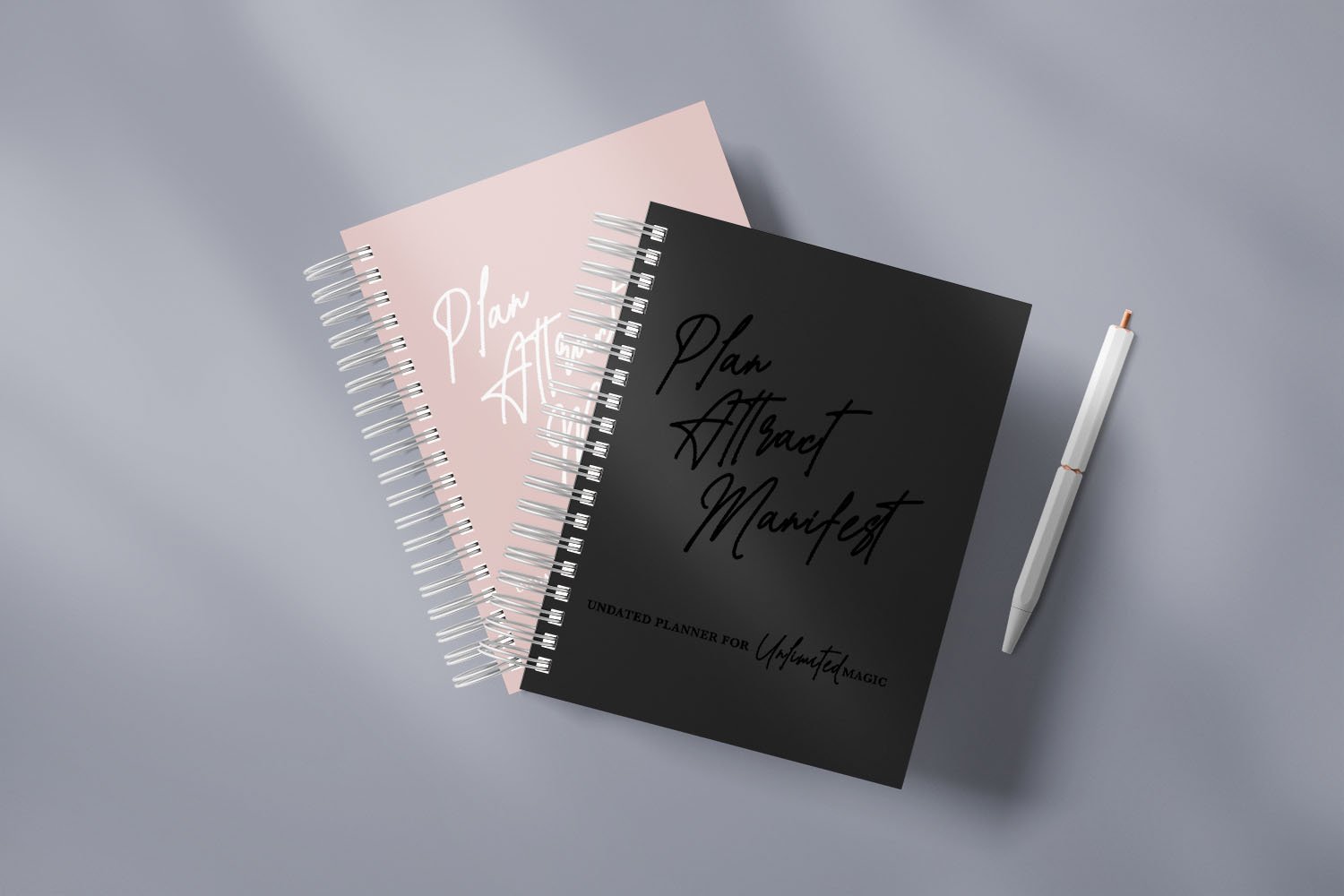 The Manifestation Planner featuring a foil embossed cover with the phrase 'Plan Attract Manifest' on the front.