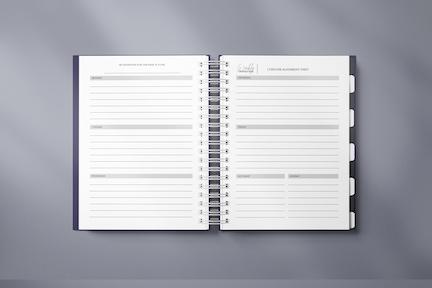 The Manifestation Planner featuring a foil embossed cover with the phrase 'Plan Attract Manifest' on the front.