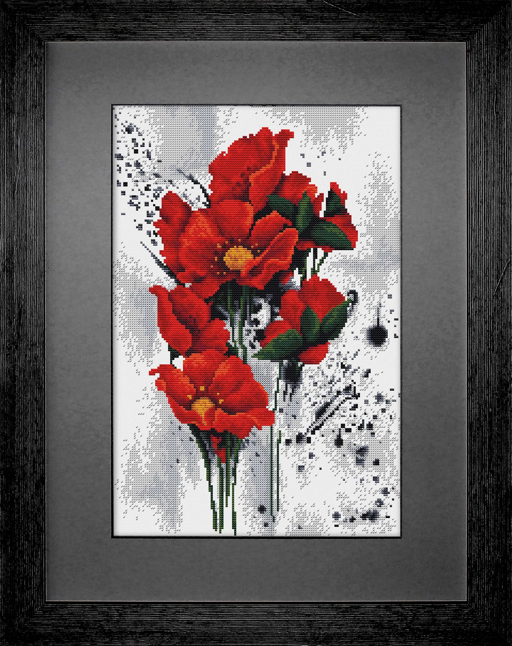 The Poppies B7014L Counted Cross-Stitch Kit featuring vibrant threads and canvas for crafting.