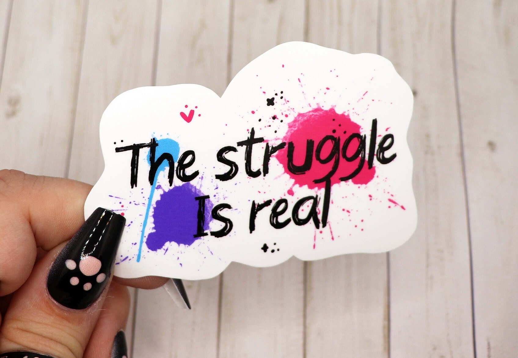 A 3-inch vinyl sticker featuring the phrase 'The Struggle is Real' in a stylish font, designed for durability and versatility.