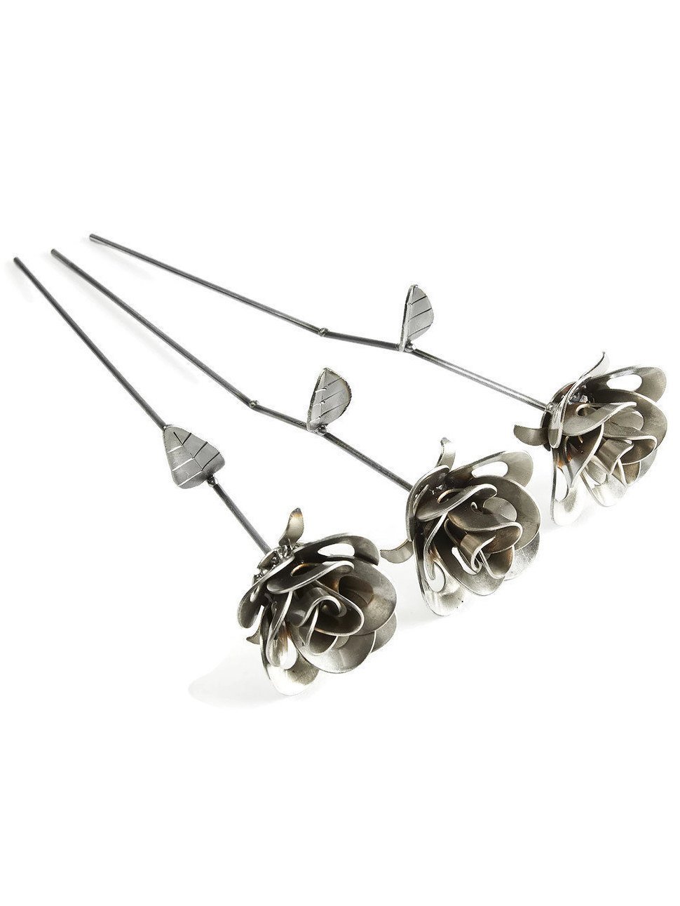 Three handcrafted welded steel roses made from recycled materials, showcasing unique designs and a rustic finish.