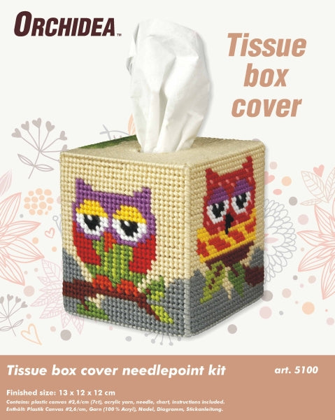 A colorful needlepoint kit featuring an owl design for a tissue box cover, including yarn, plastic canvas, and instructions.