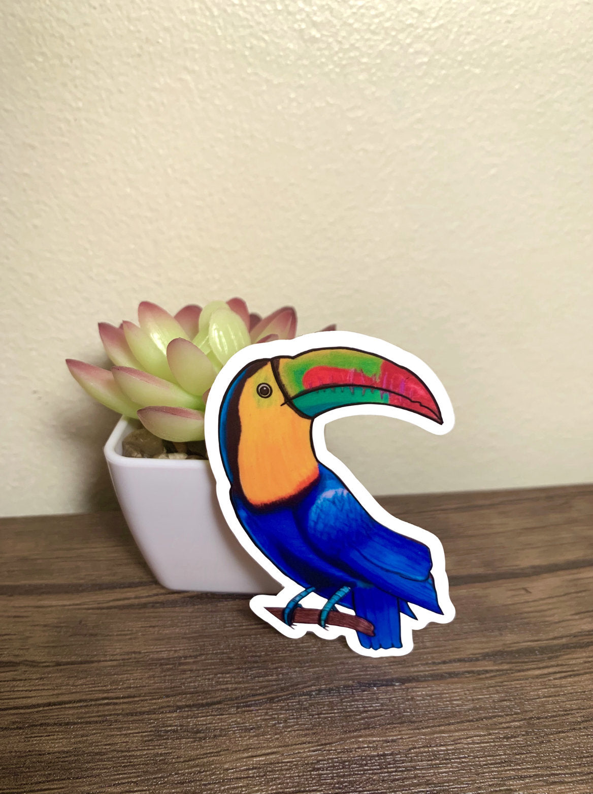 A colorful toucan sticker featuring a cute toucan design, perfect for personalizing items like laptops and water bottles.