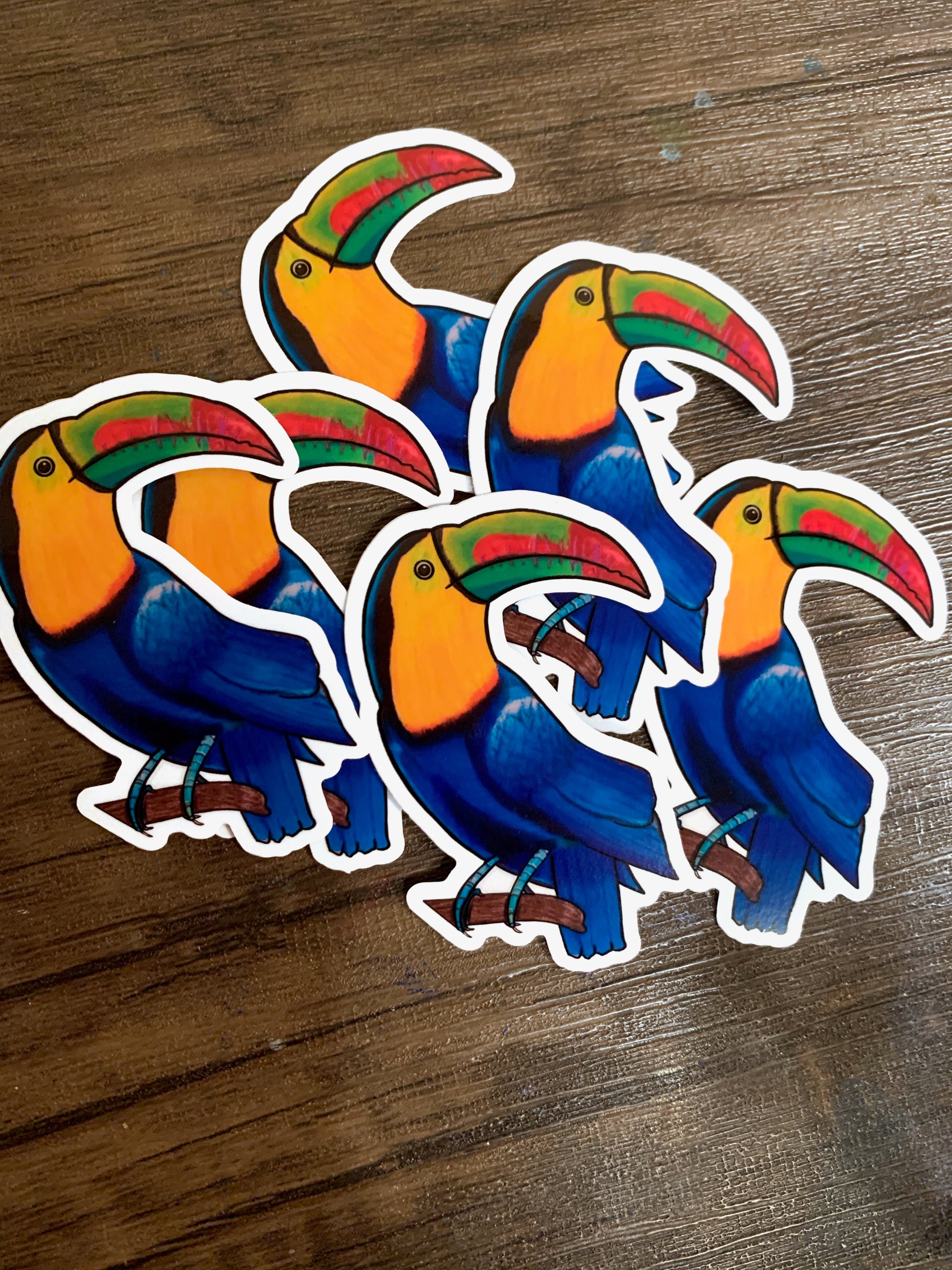 A colorful toucan sticker featuring a cute toucan design, perfect for personalizing items like laptops and water bottles.