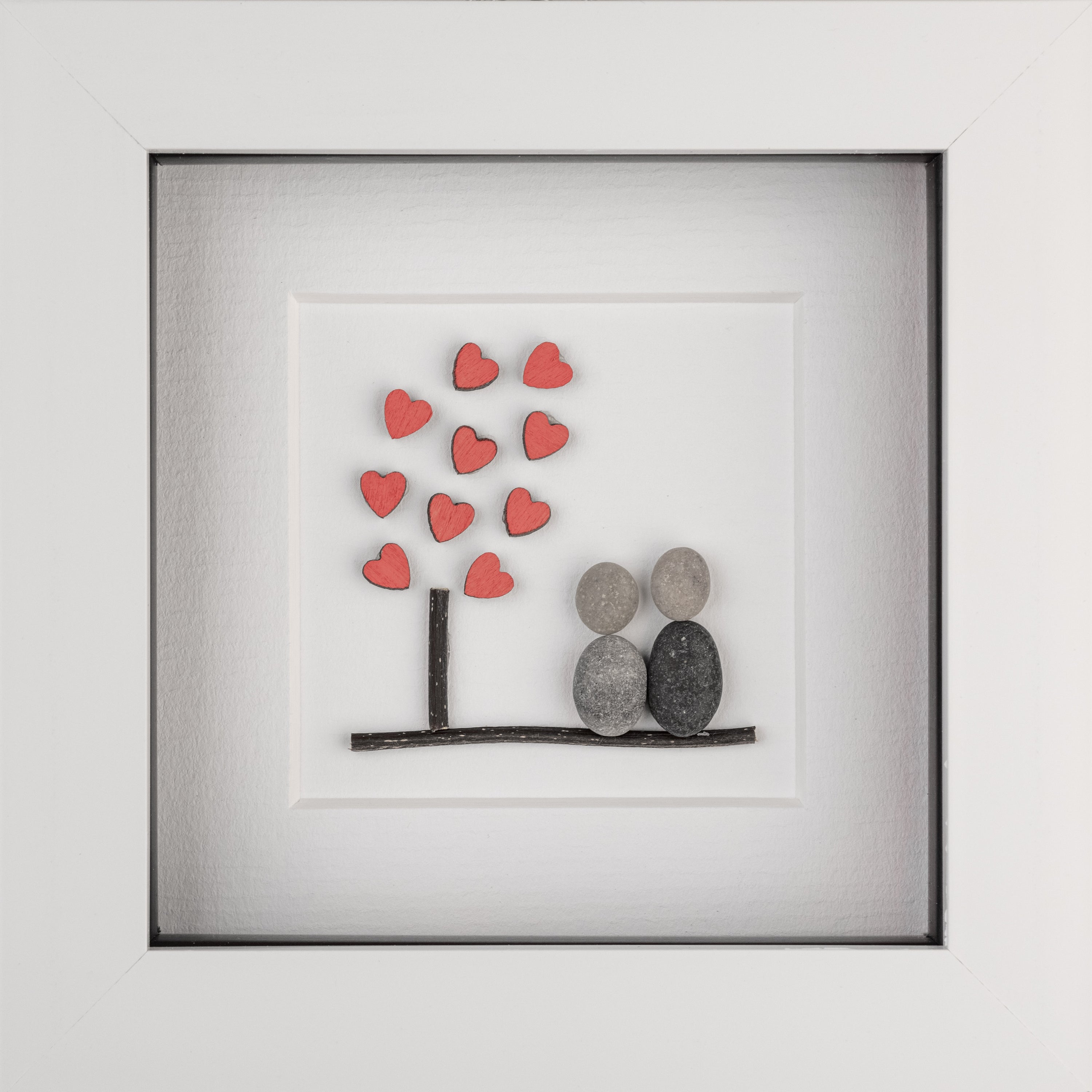 A beautifully framed Tree of Hearts artwork featuring tiny red hearts, perfect for couples and special occasions.