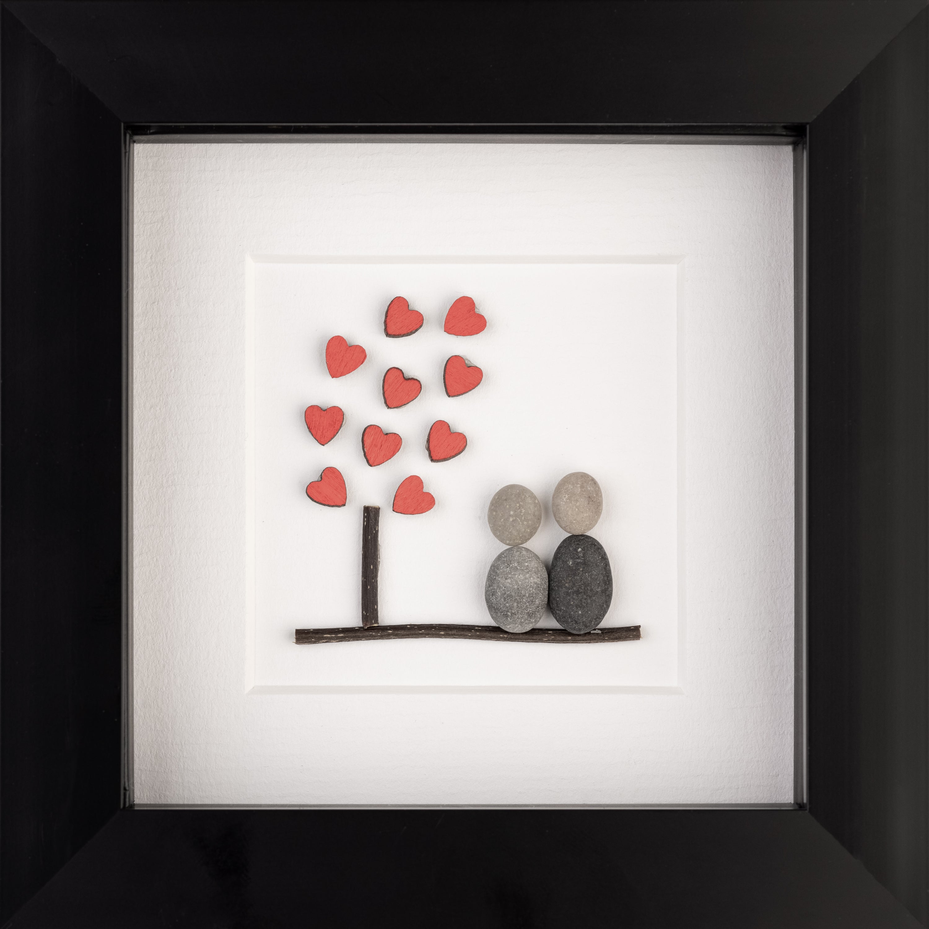 A beautifully framed Tree of Hearts artwork featuring tiny red hearts, perfect for couples and special occasions.