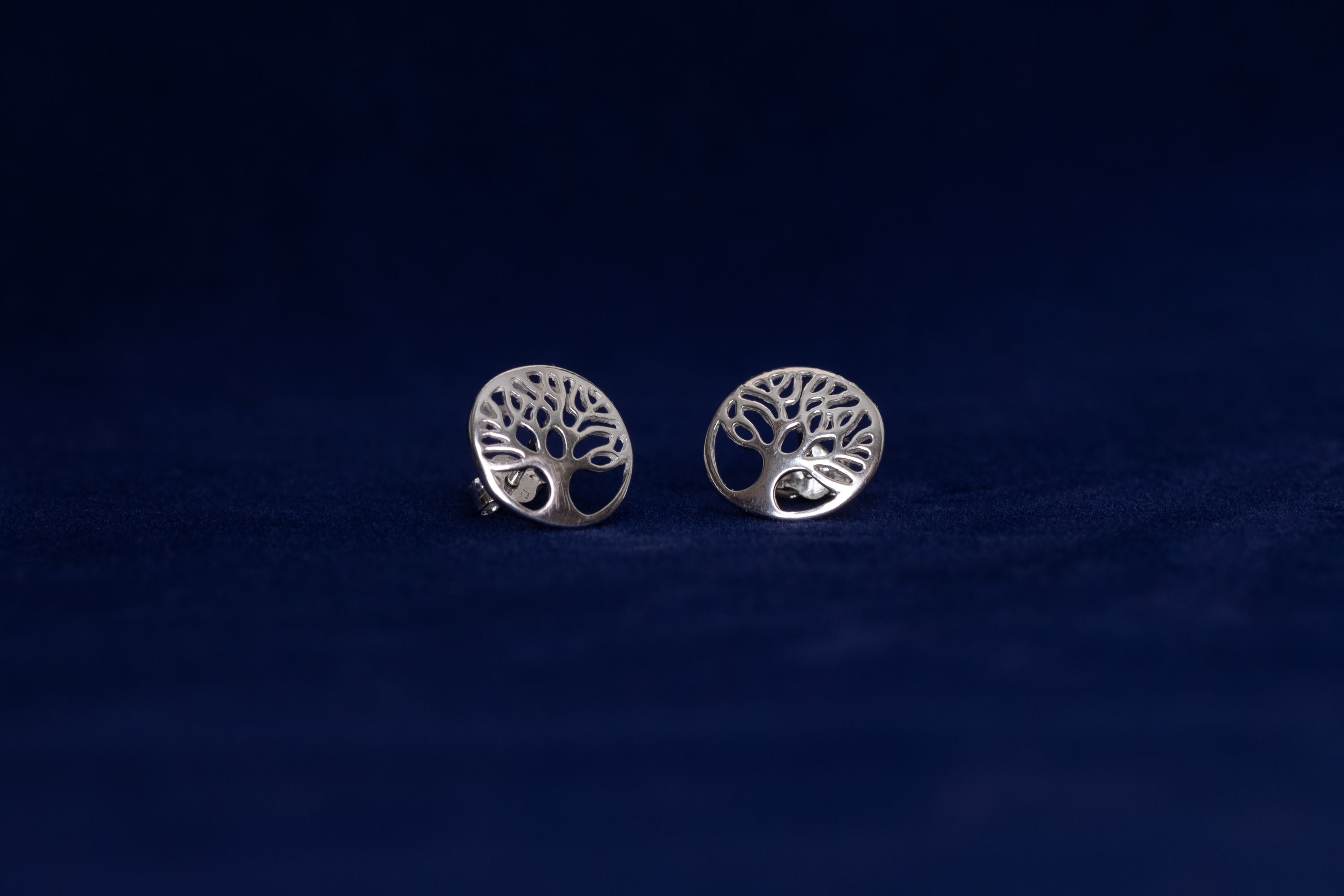 Sterling silver Tree of Life earrings featuring intricate design symbolizing strength and togetherness.