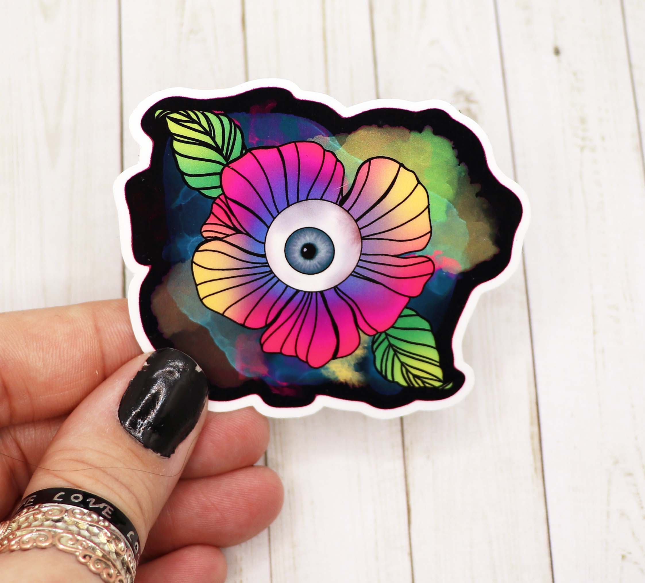 Colorful Trippy Eyeball Sticker on a white background, showcasing its unique design and vibrant colors.