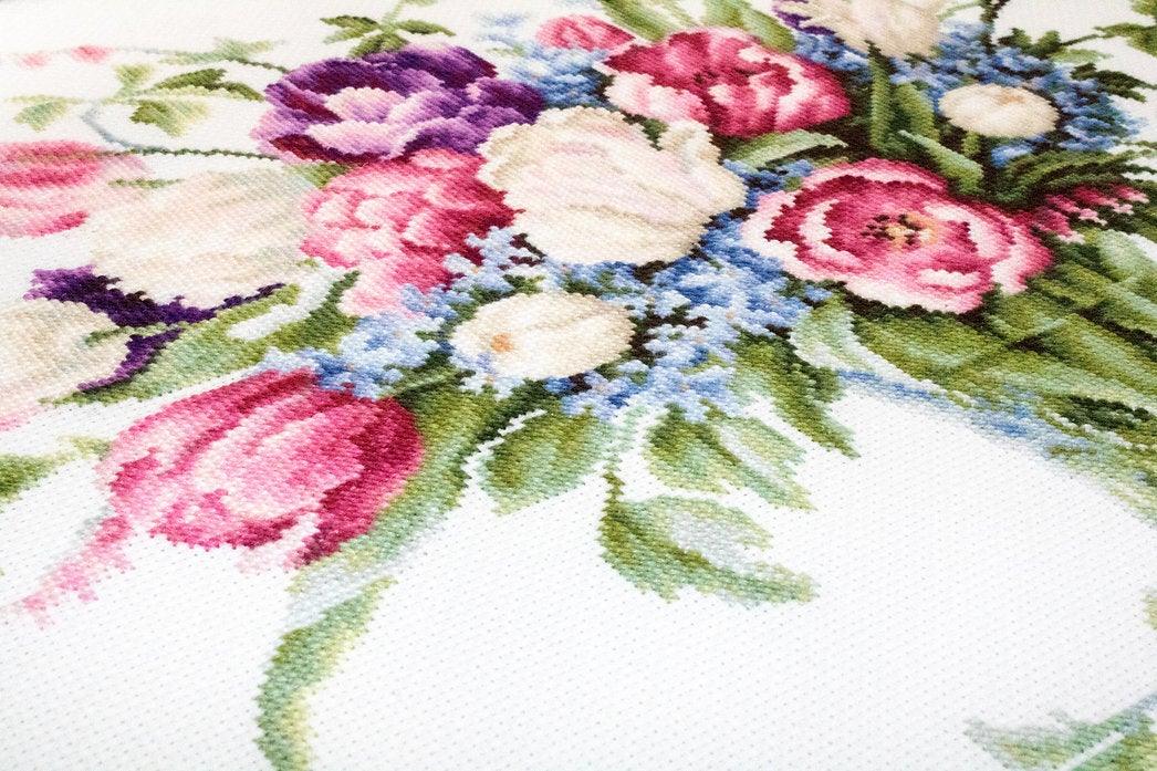 Tulips B2261L Counted Cross-Stitch Kit featuring vibrant threads, Aida canvas, and needle for crafting floral artwork.