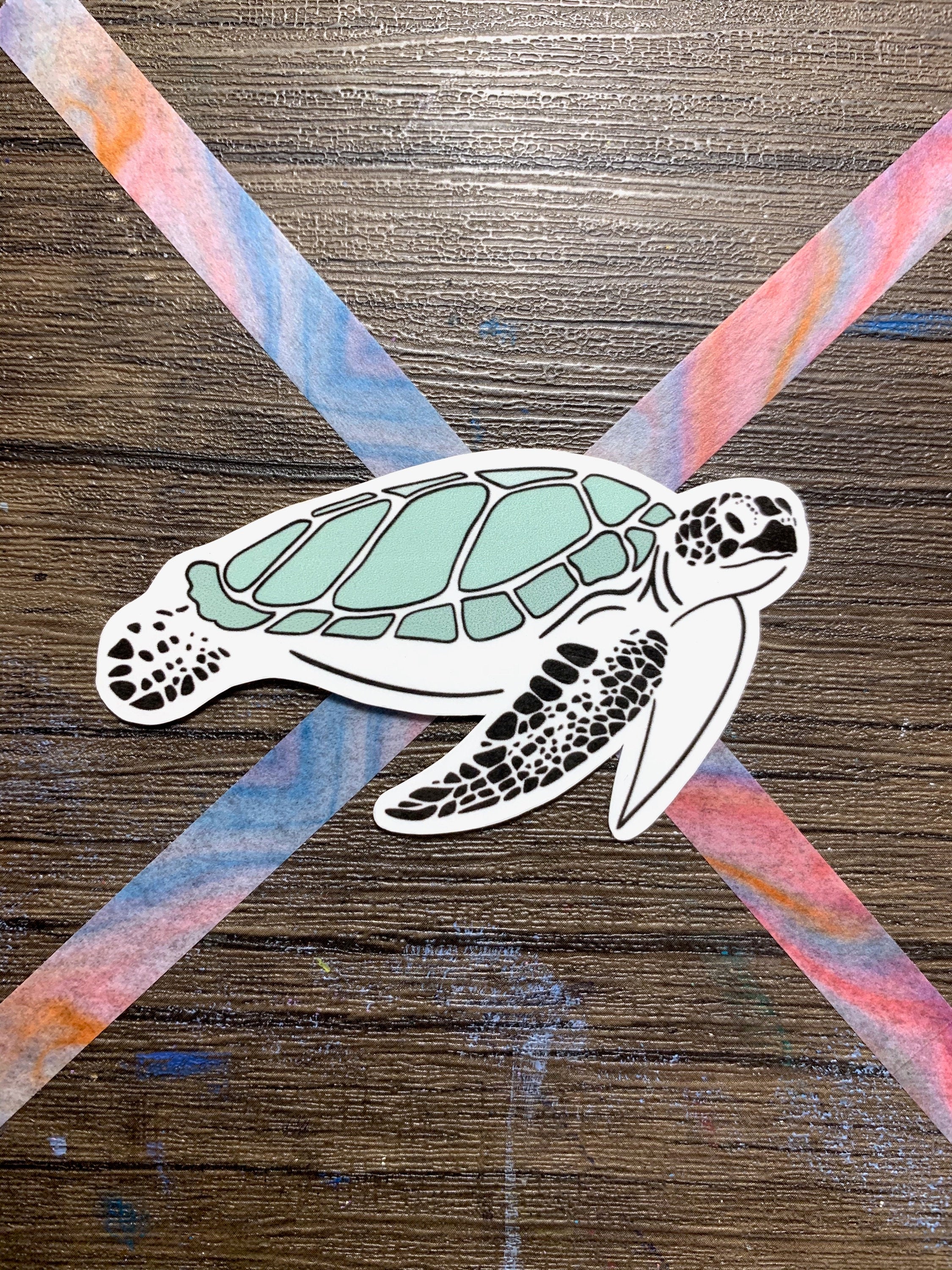 A cute turtle sticker designed for customization, featuring vibrant colors and a waterproof finish, perfect for laptops and water bottles.