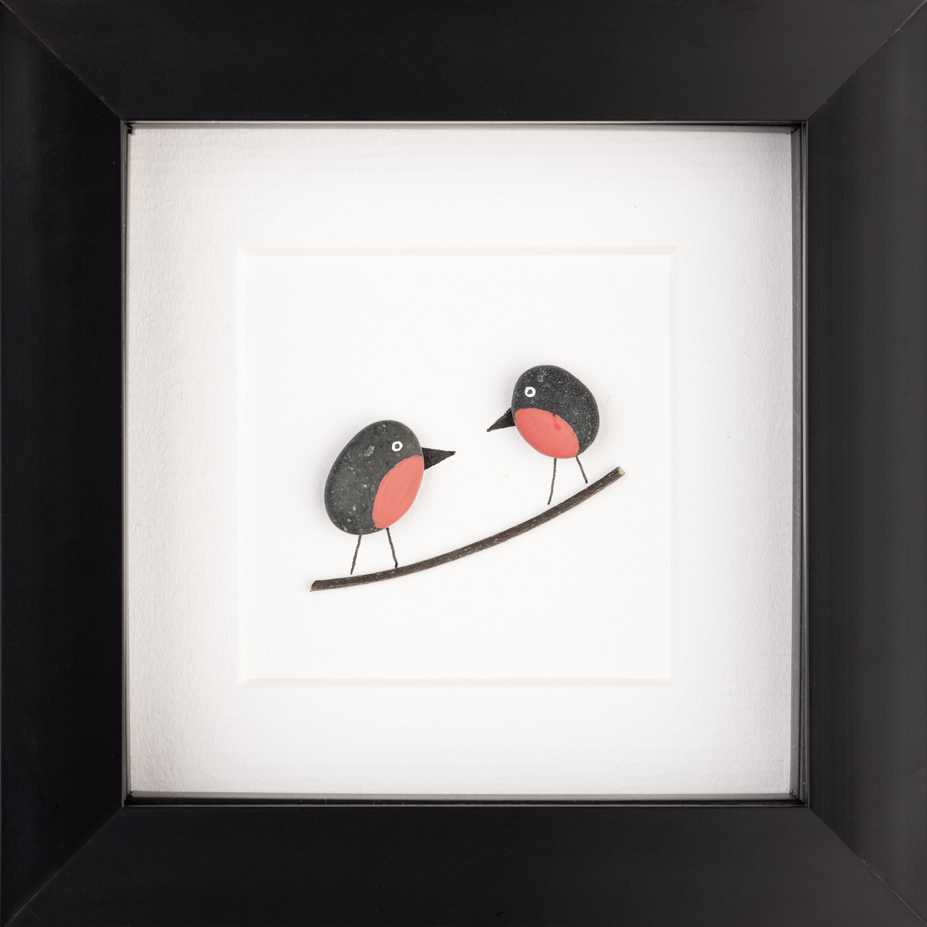 A beautifully framed artwork of two little robins, showcasing their delicate features and vibrant colors, perfect for nature lovers.