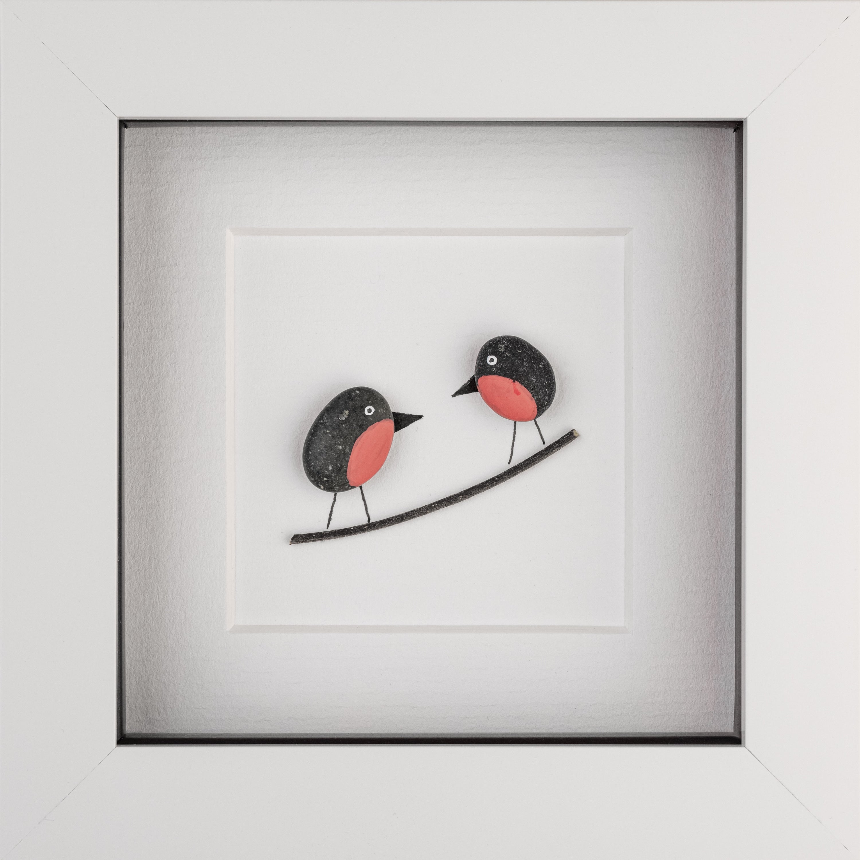 A beautifully framed artwork of two little robins, showcasing their delicate features and vibrant colors, perfect for nature lovers.