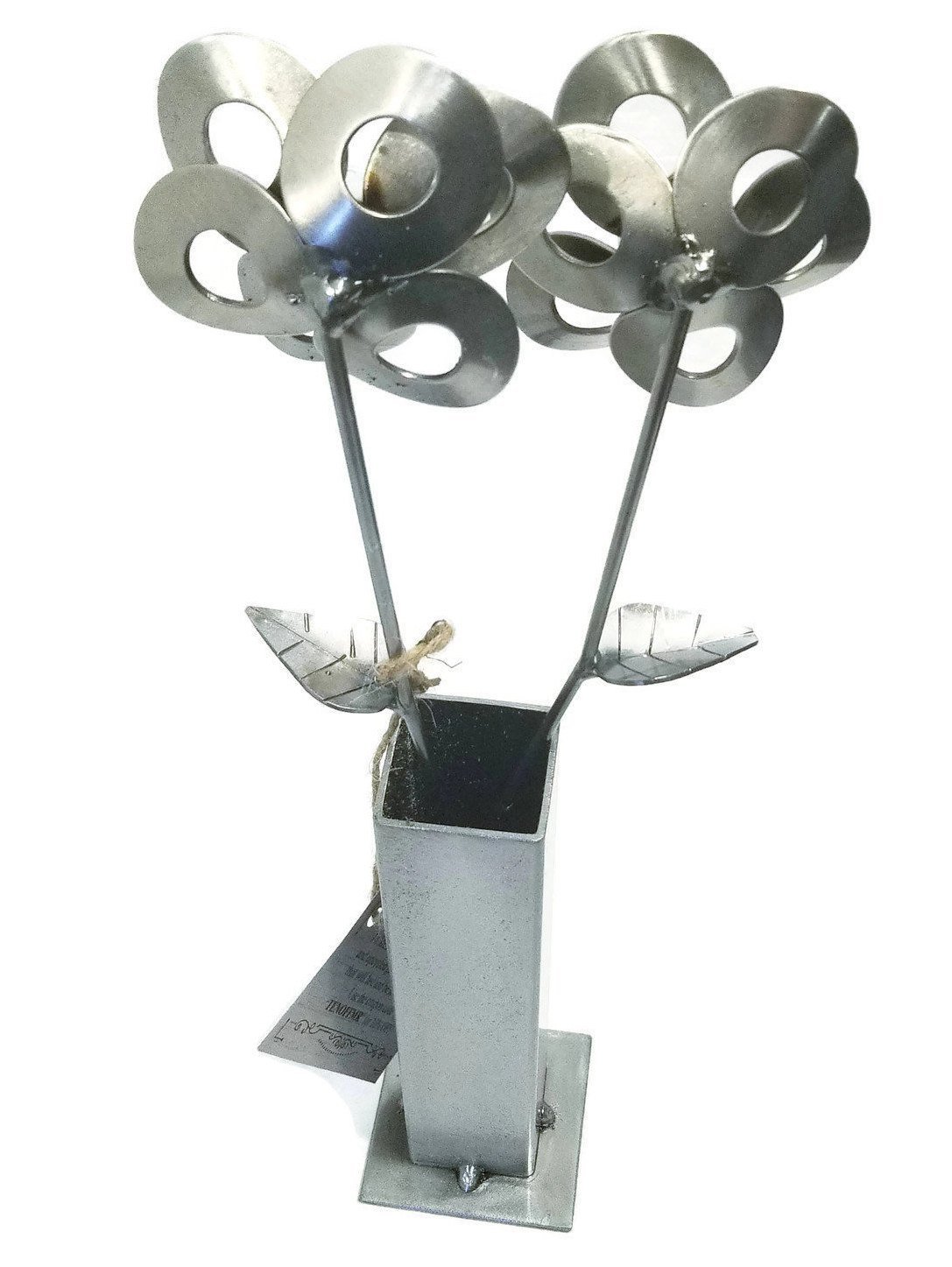 Two handcrafted metal flowers made from recycled materials, displayed in a steel vase, showcasing unique welded art.