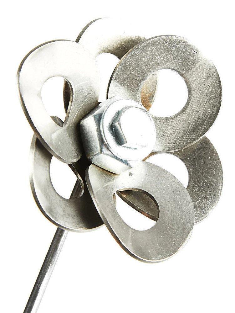 Two handcrafted metal flowers made from recycled materials, displayed in a steel vase, showcasing unique welded art.