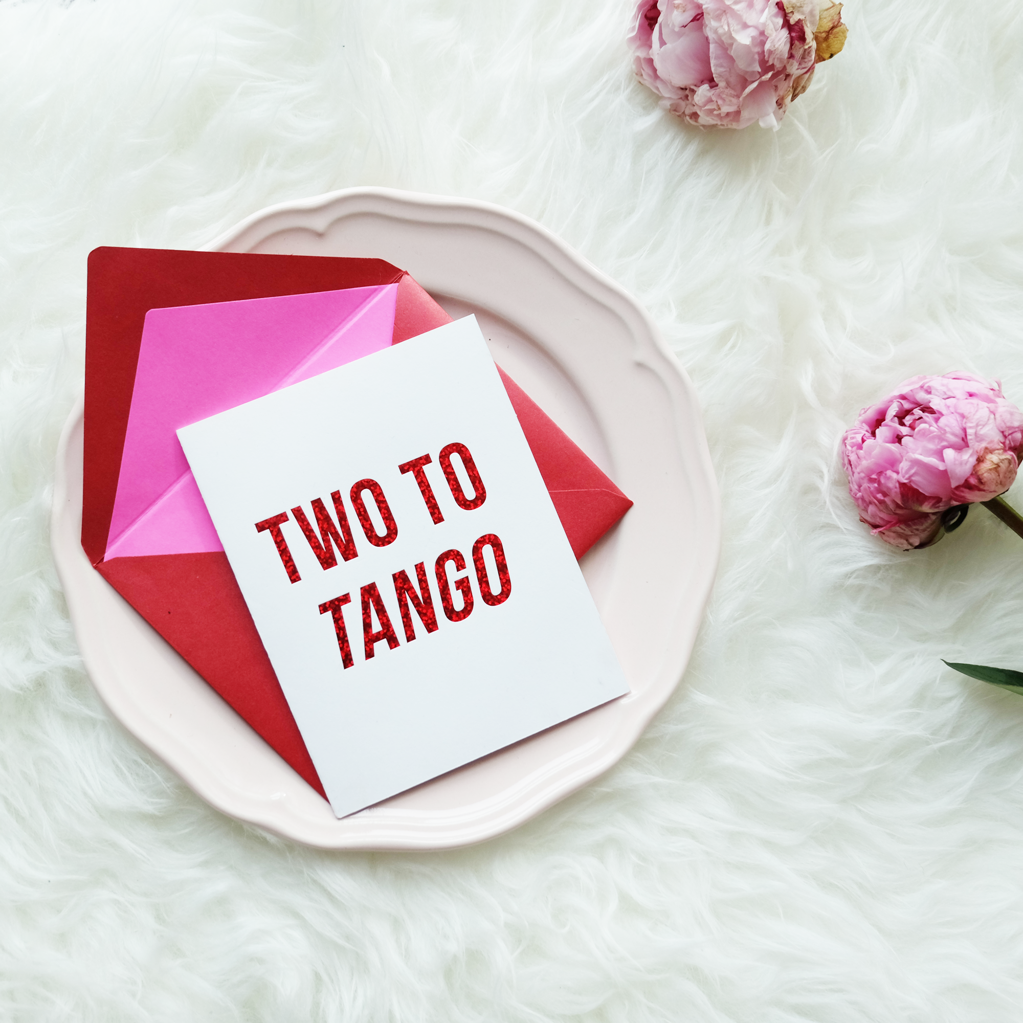 Stylish 'Two To Tango' greeting card with red glitter foil accents and lined envelope, perfect for celebrating friendship.