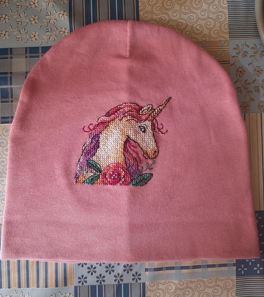 Unicorn cross stitch kit featuring colorful threads and water soluble canvas, perfect for crafting enthusiasts.