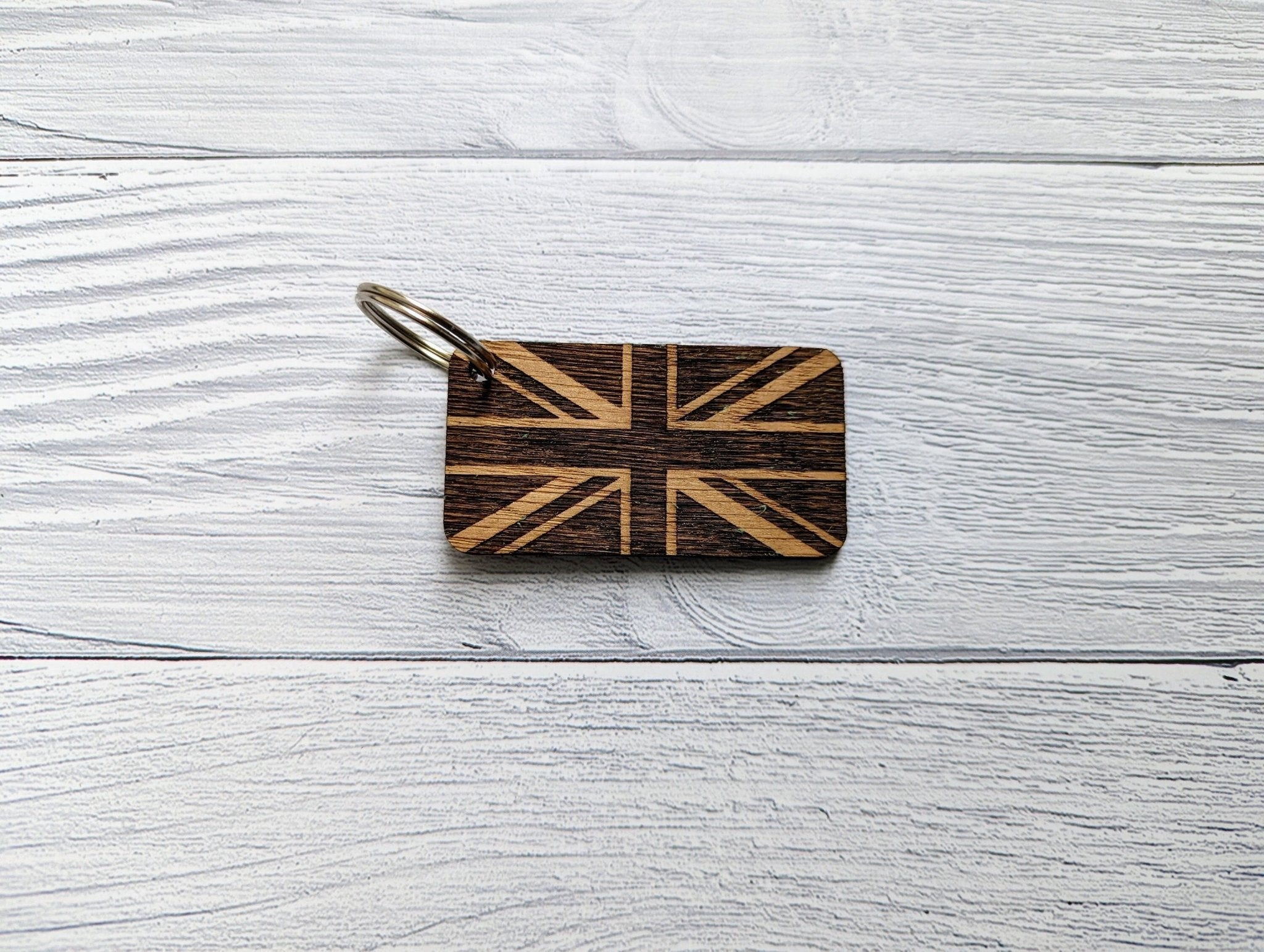 Handmade Union Jack Keyring made from oak MDF, featuring laser engraved design, measuring 65mm x 35mm.